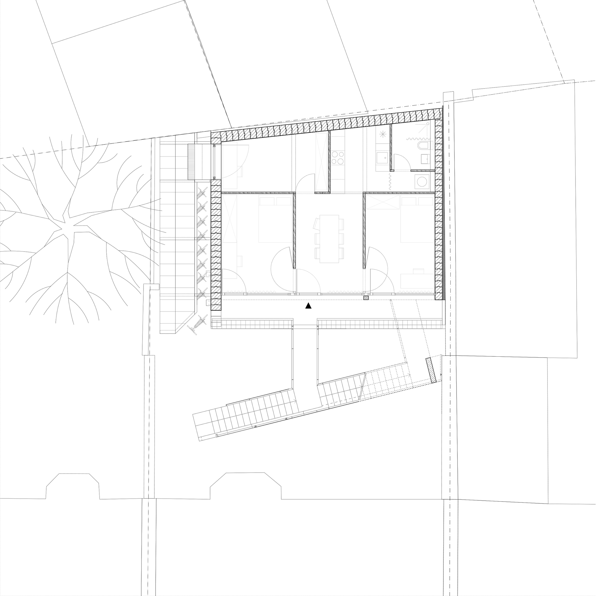 First floor plan drawing showing two interior rooms with a diagonal staircase element and adjacent street trees