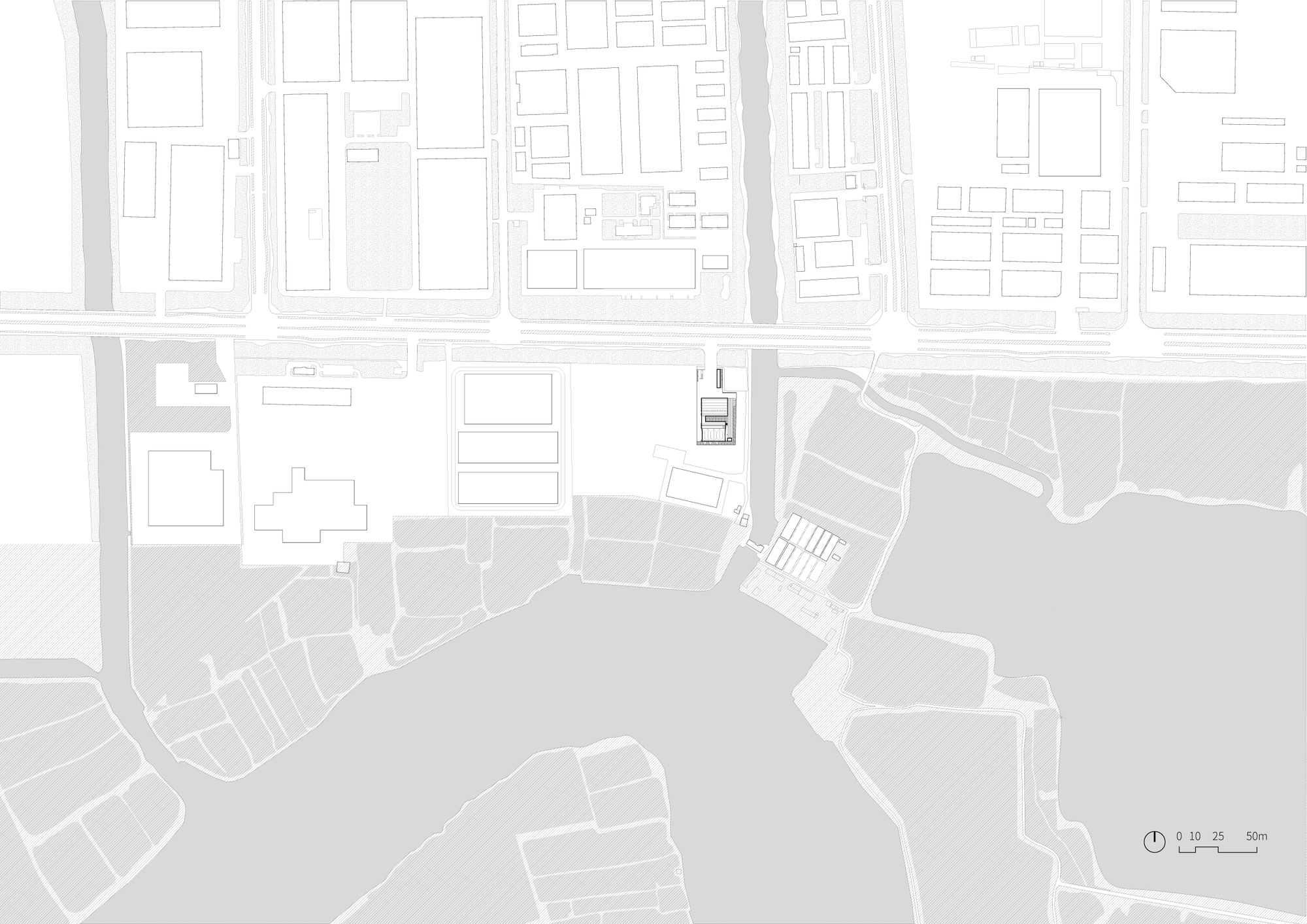 Site plan drawing showing the building footprint positioned between urban blocks and a waterfront edge