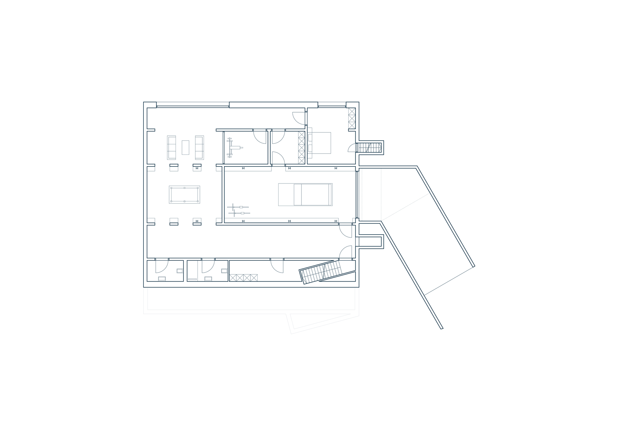 Floor plan drawing showing living spaces with angled wing and central circulation