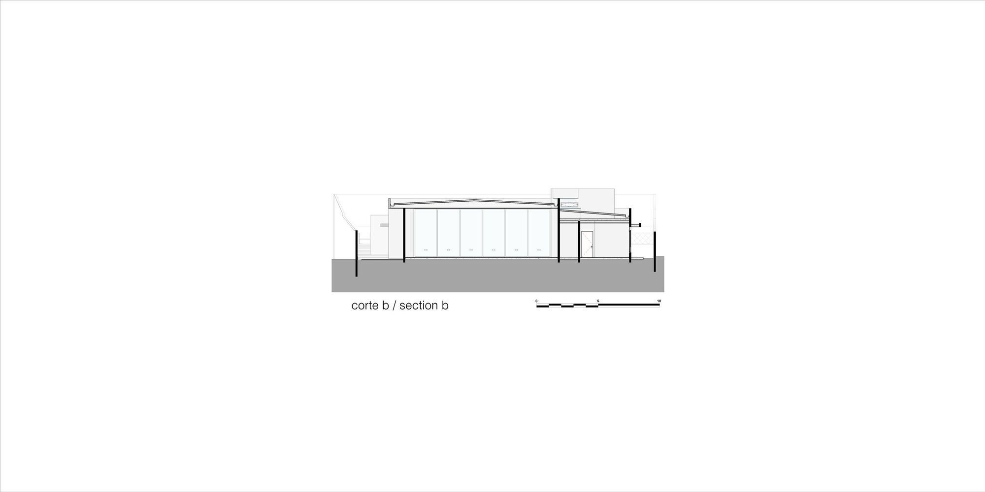 Section drawing revealing interior volumes with sloped roof and vertical slat screen