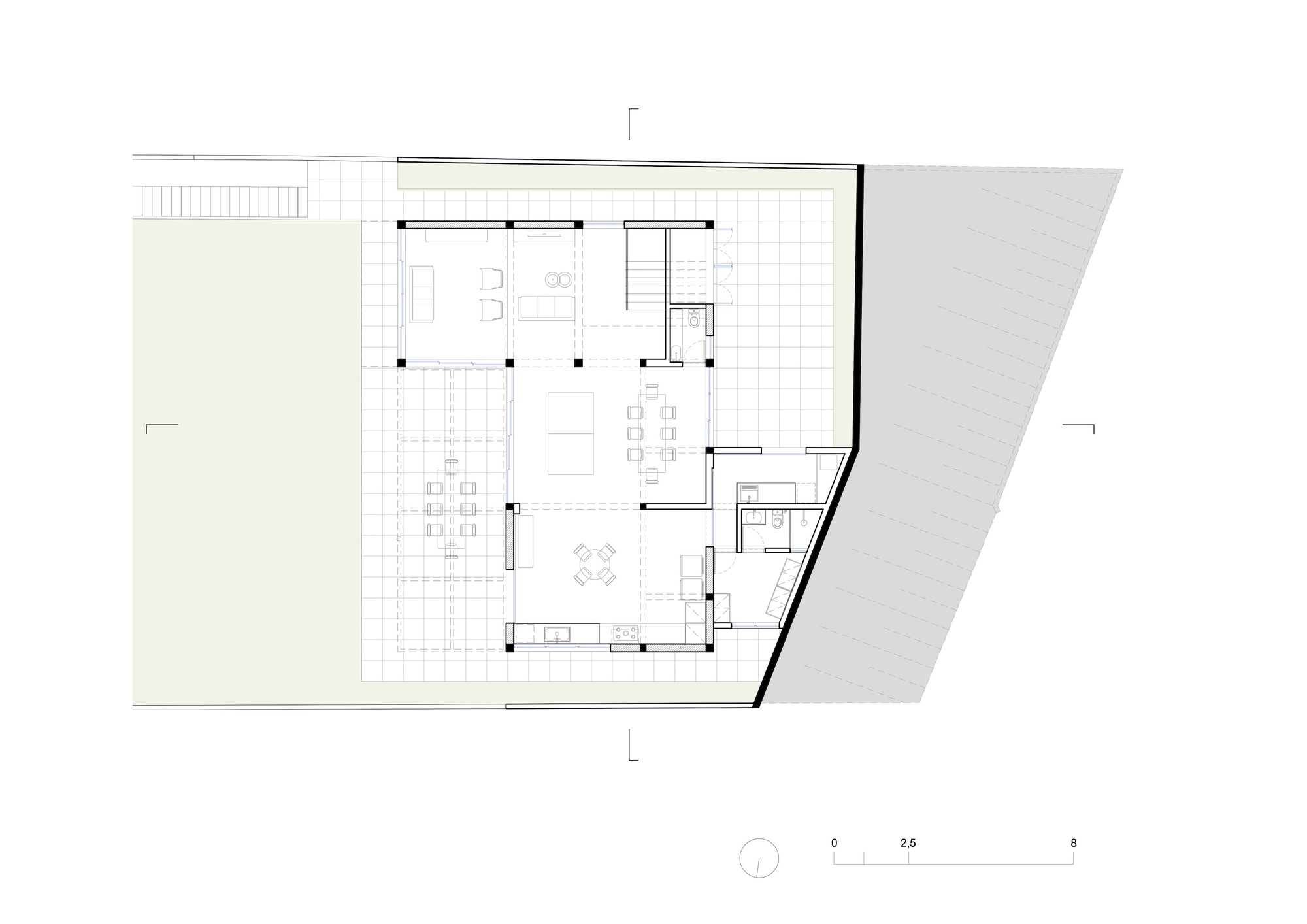 Floor plan drawing showing open living area with gridded terrace and angled street edge