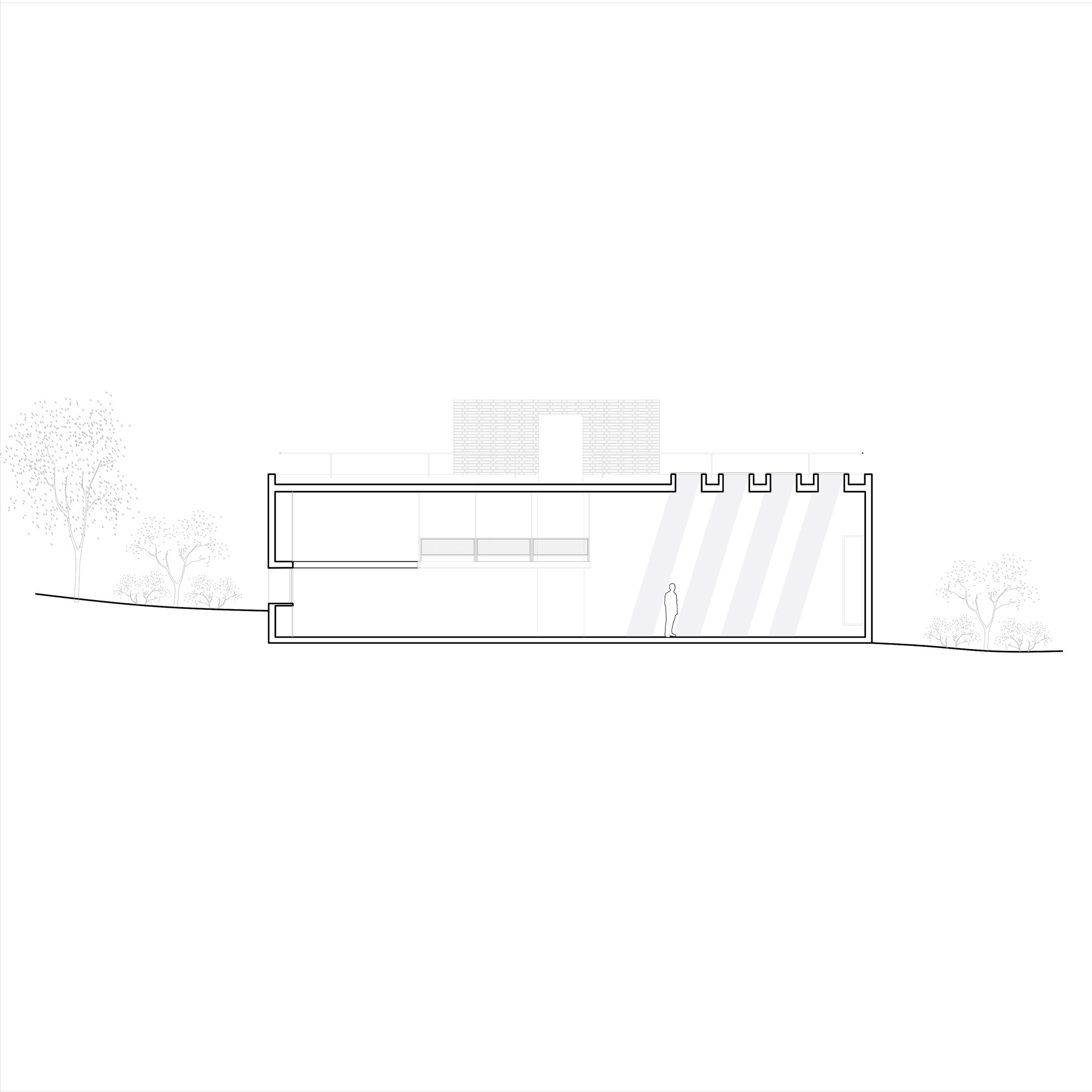 Section drawing showing a two-level structure with rooftop parapets and a human figure for scale