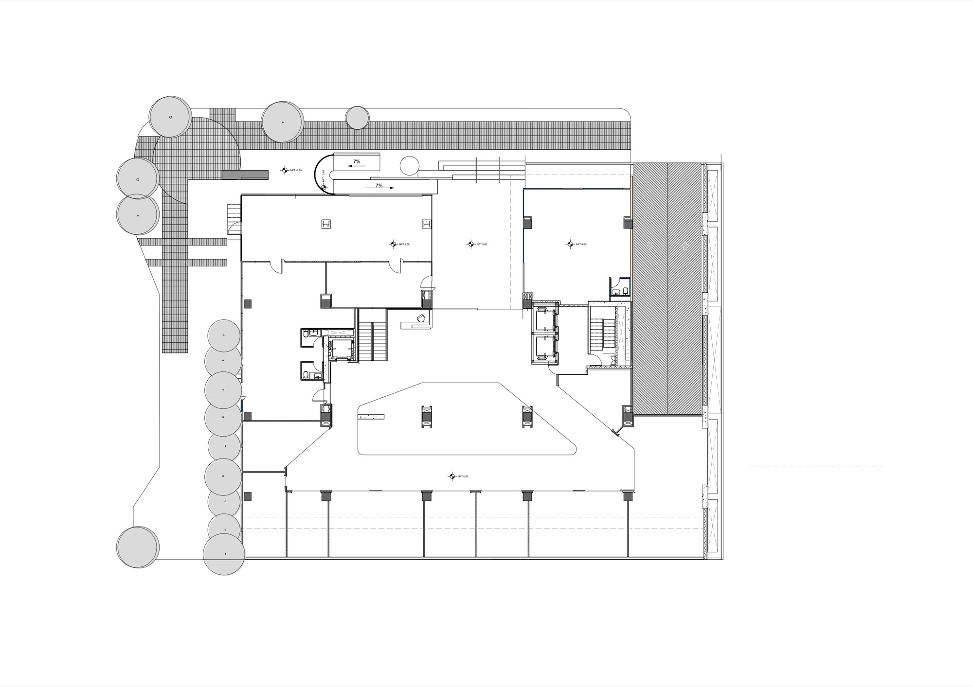 Ground floor plan showing entrance courtyard with tree grove and central atrium with curved skylight