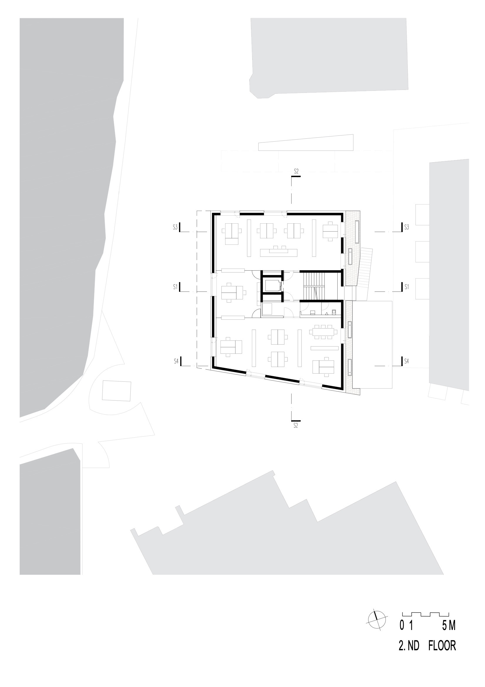 Second floor plan showing open living spaces and central stairwell with surrounding terraces