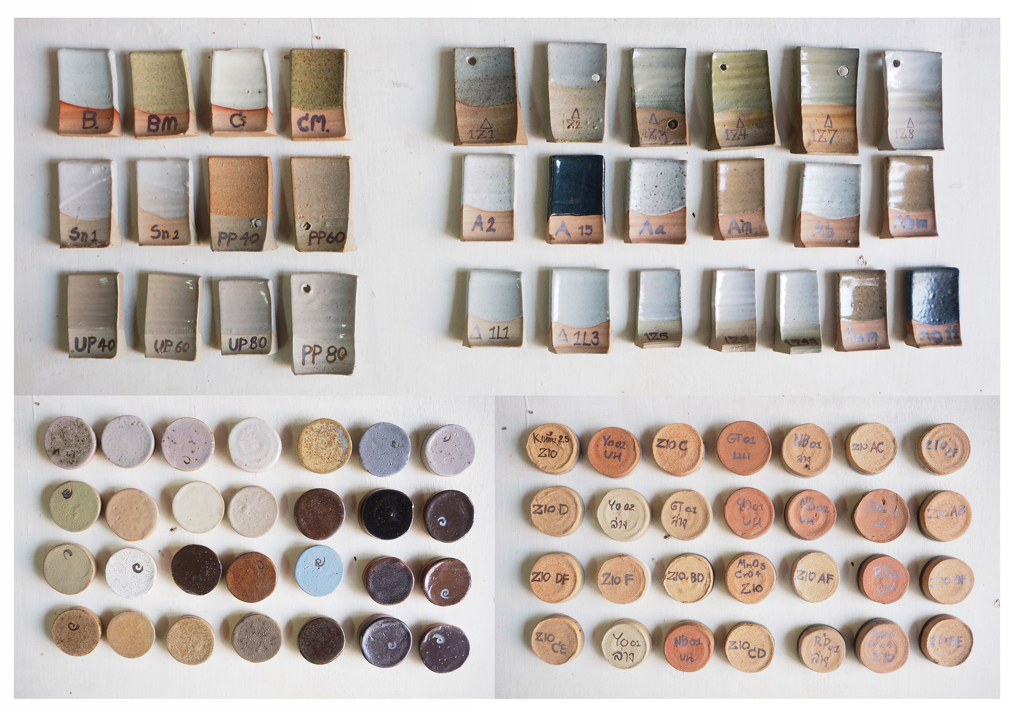 Grid of labeled ceramic test samples showing layered glazes and clay body formulations