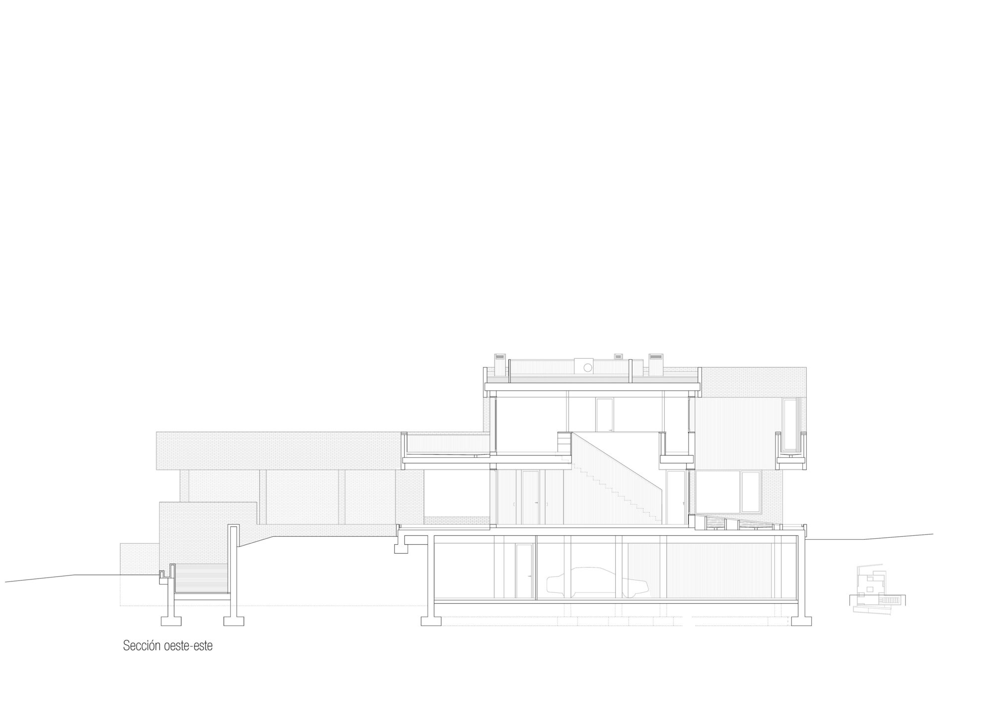 Section drawing showing the split-level arrangement and structural system across the sloping terrain