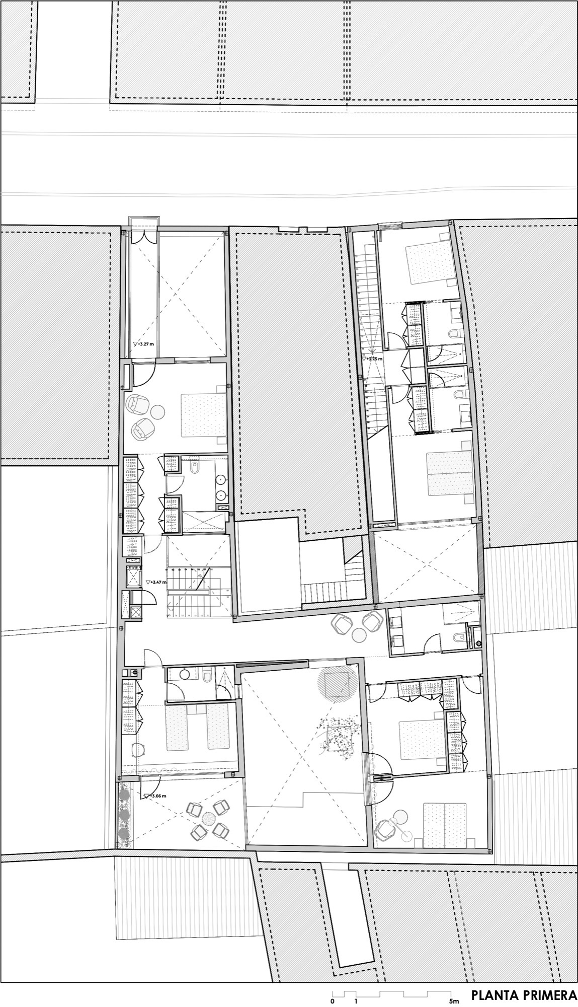 First floor plan drawing showing bedrooms, bathrooms, and terraces arranged around a central courtyard
