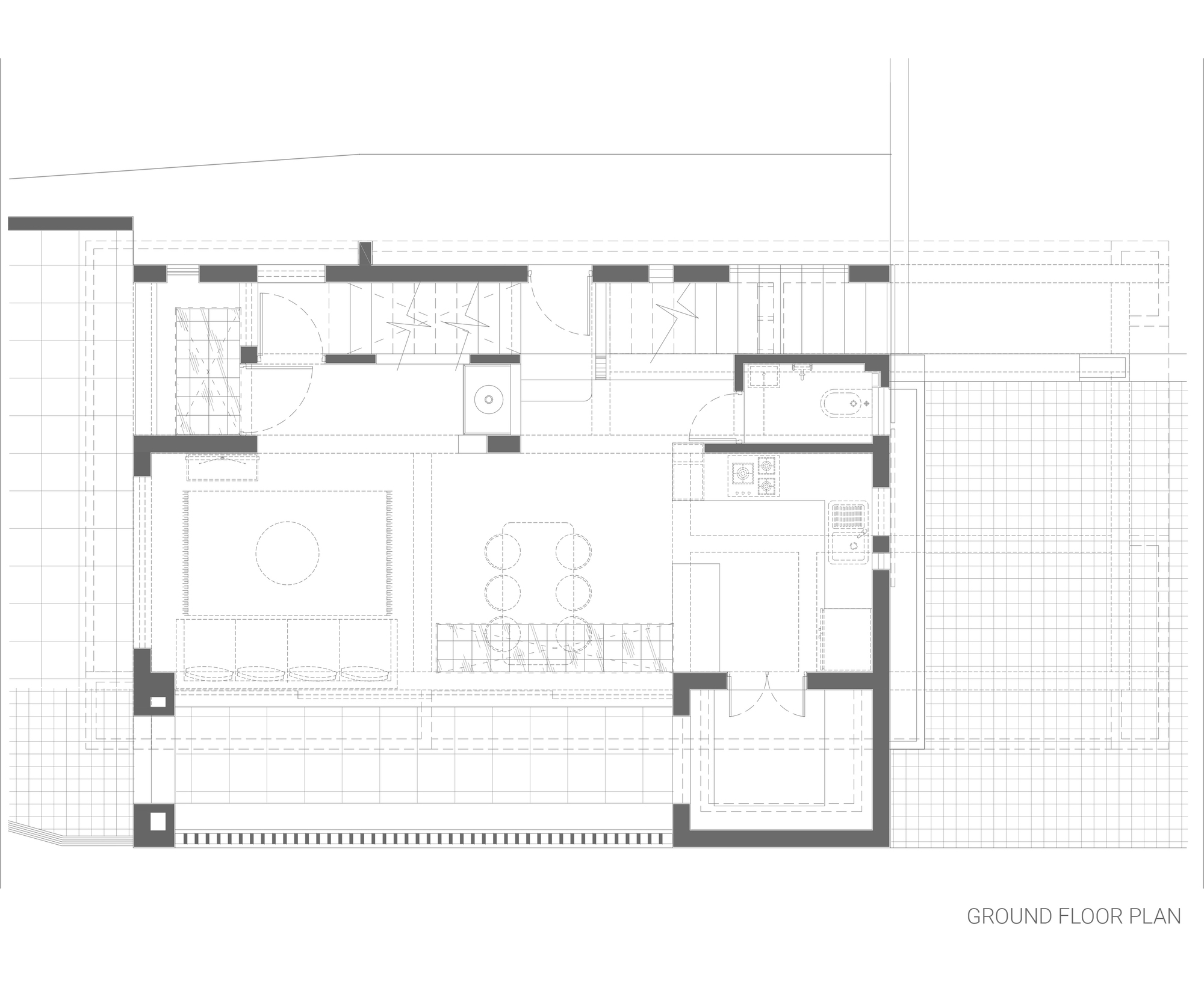 Ground floor plan drawing showing living and dining areas with outdoor terrace on grid