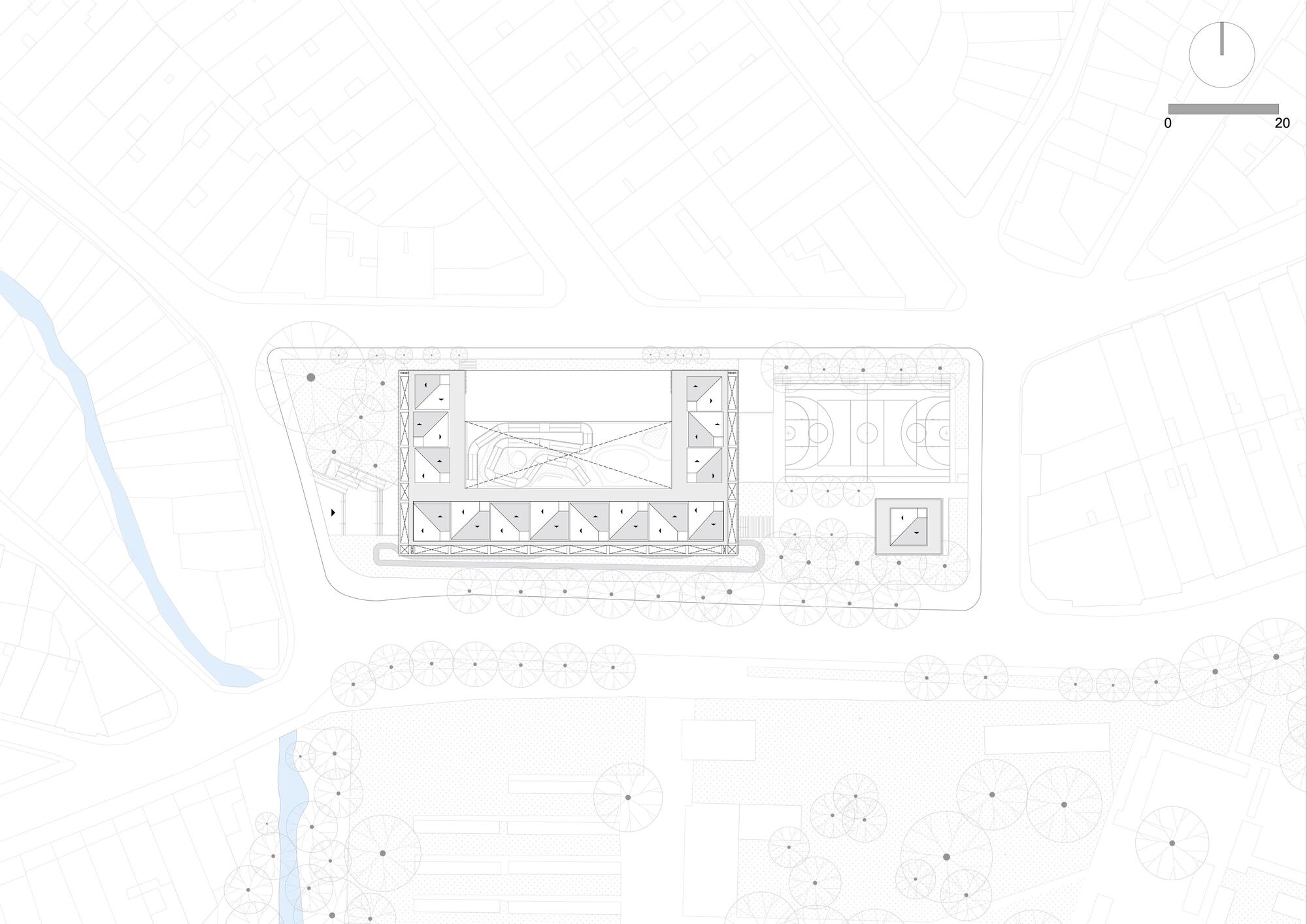 Site plan drawing depicting rectangular building footprint with sports courts surrounded by scattered landscape circles