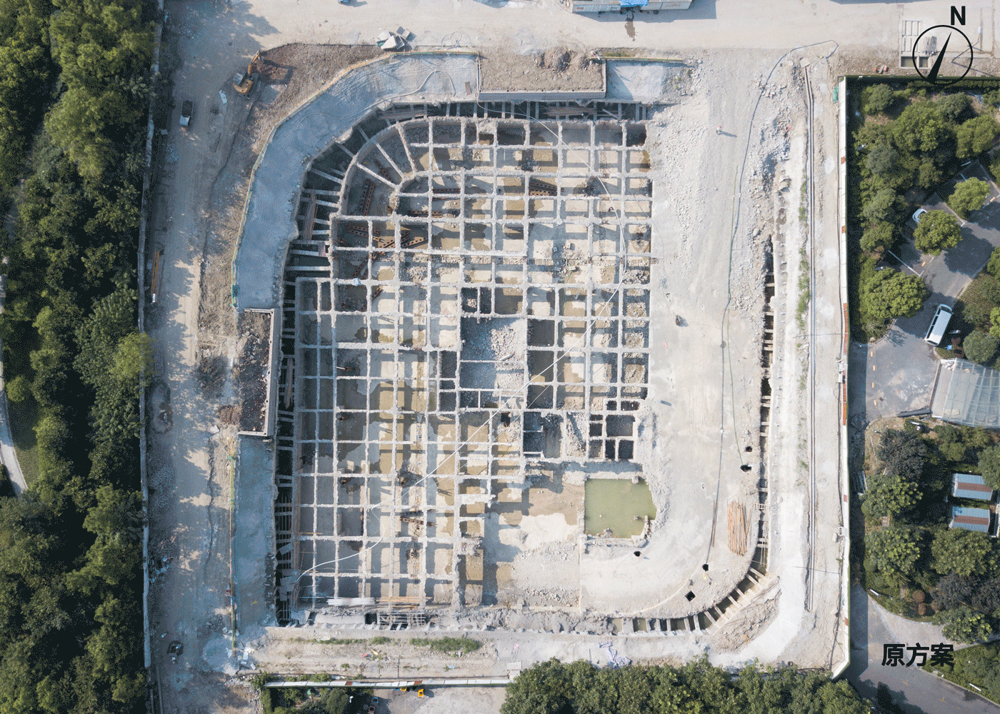 Aerial view of the gridded foundation layout on exposed earth during construction