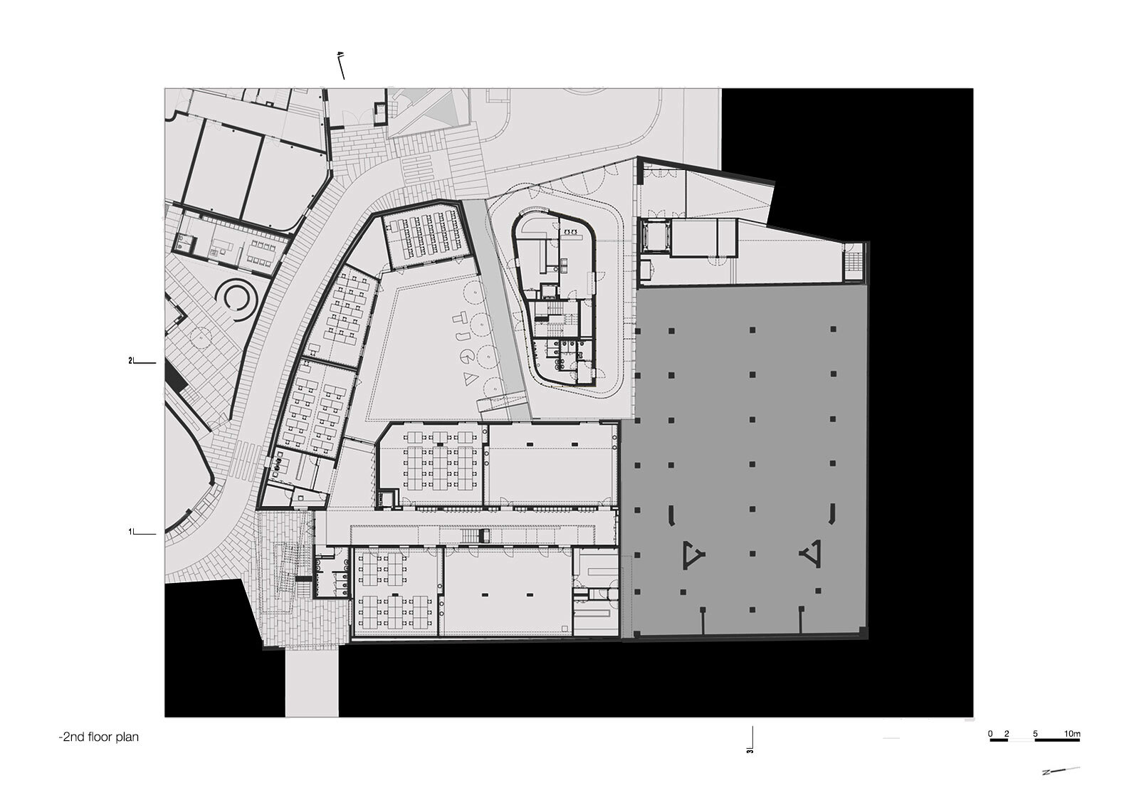 Second floor plan drawing showing auditorium, corridors, parking area, and adjacent volumes