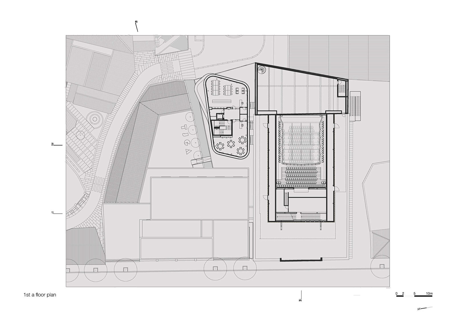 First subterranean floor plan showing reduced building footprint with performance hall and curved courtyard structure