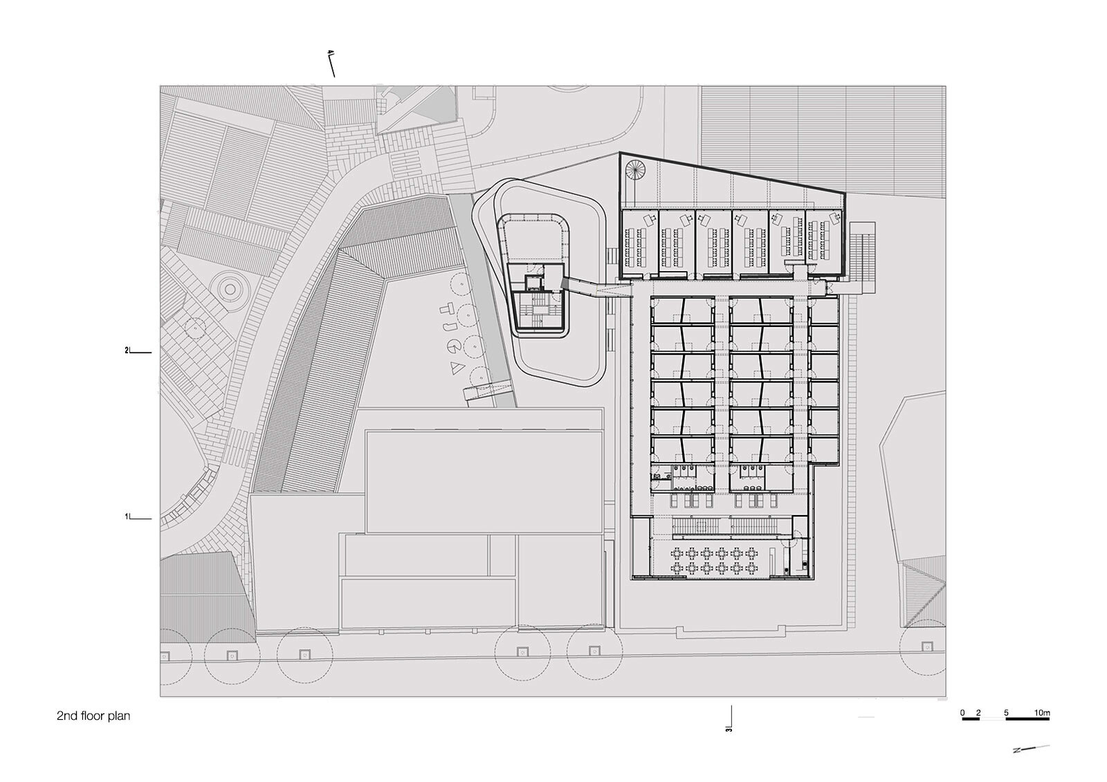 Second floor plan drawing displaying grid of rooms along one wing and smaller pavilion with curved courtyard