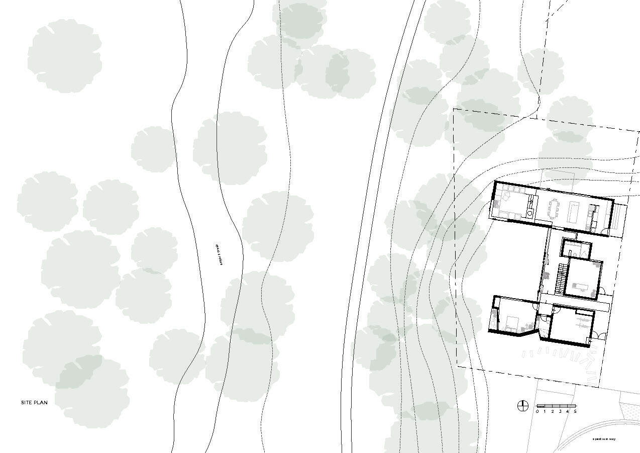 Site plan drawing showing building footprint among existing trees and contour lines