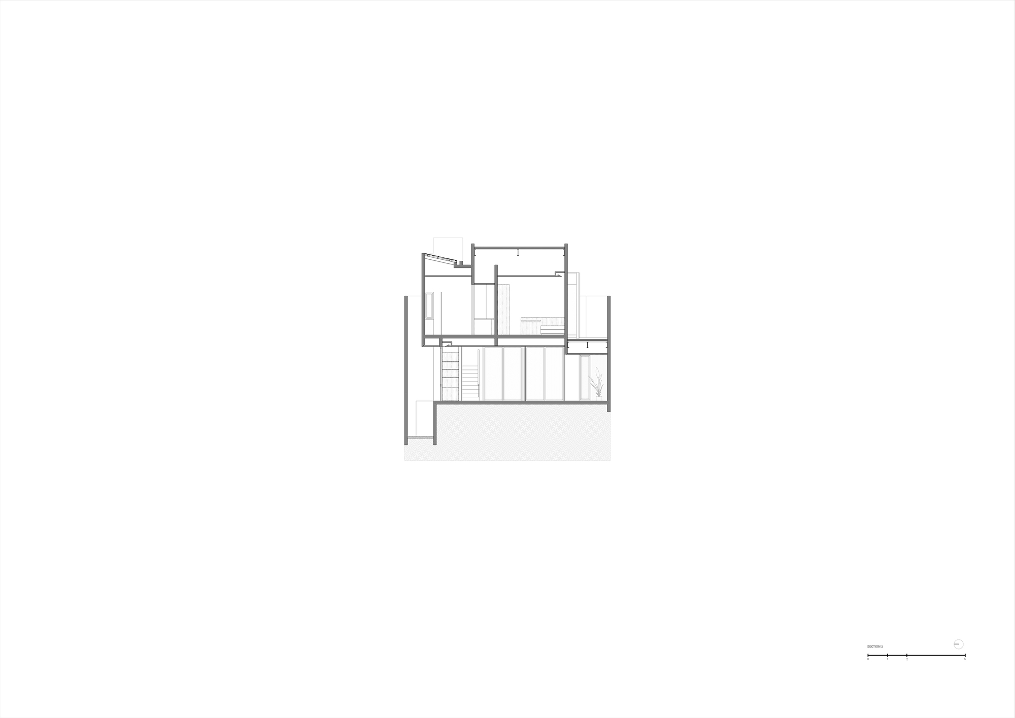 Section drawing revealing interior spatial relationships across multiple levels with a central staircase
