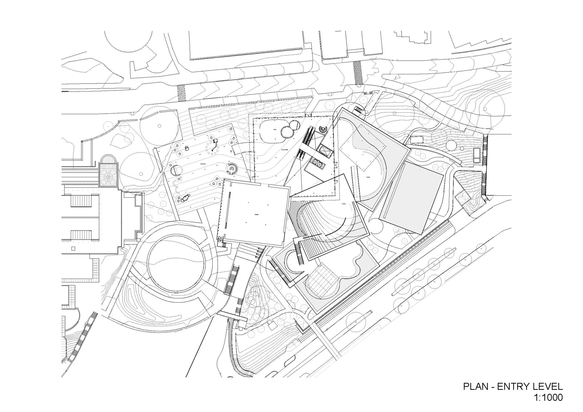 Entry level floor plan drawing showing irregular building volumes around landscaped terraces and circulation paths