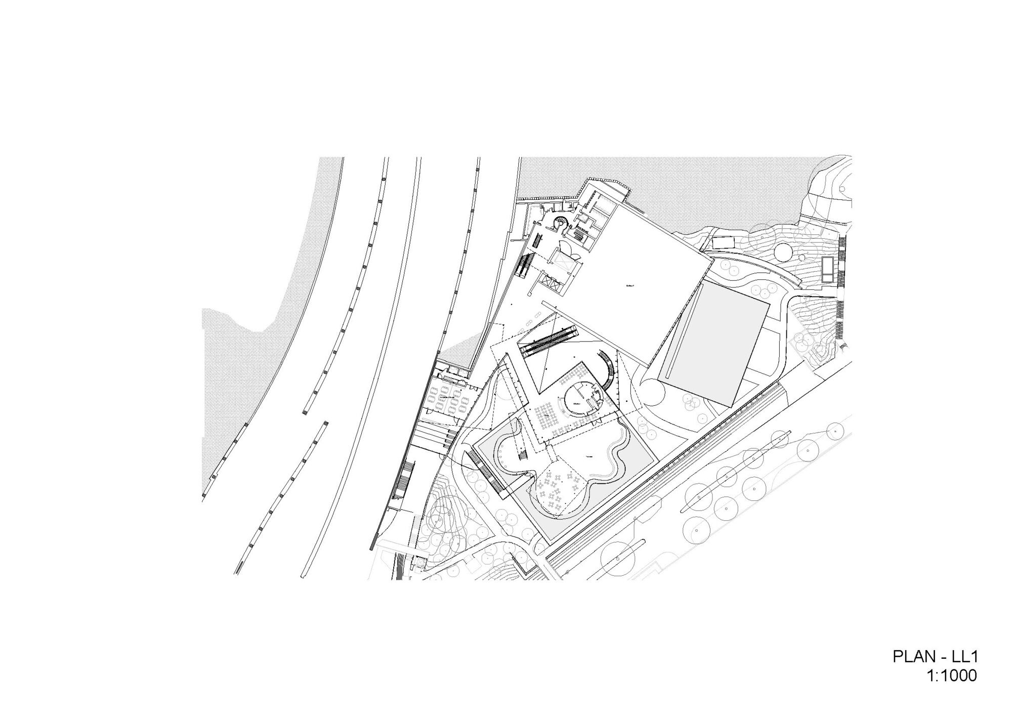 Floor plan drawing of level one showing angular volumes adjacent to railway tracks and waterfront edge