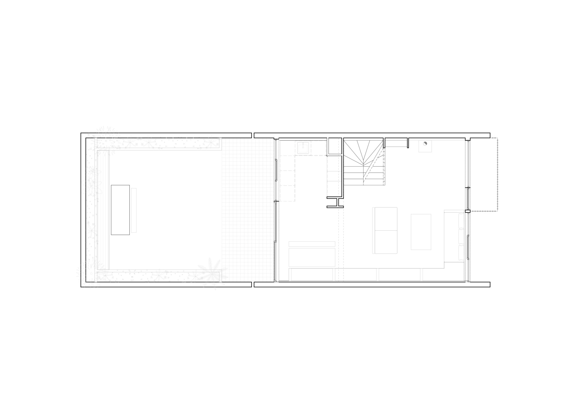 Floor plan drawing showing two rectangular rooms divided by a wall with central stair