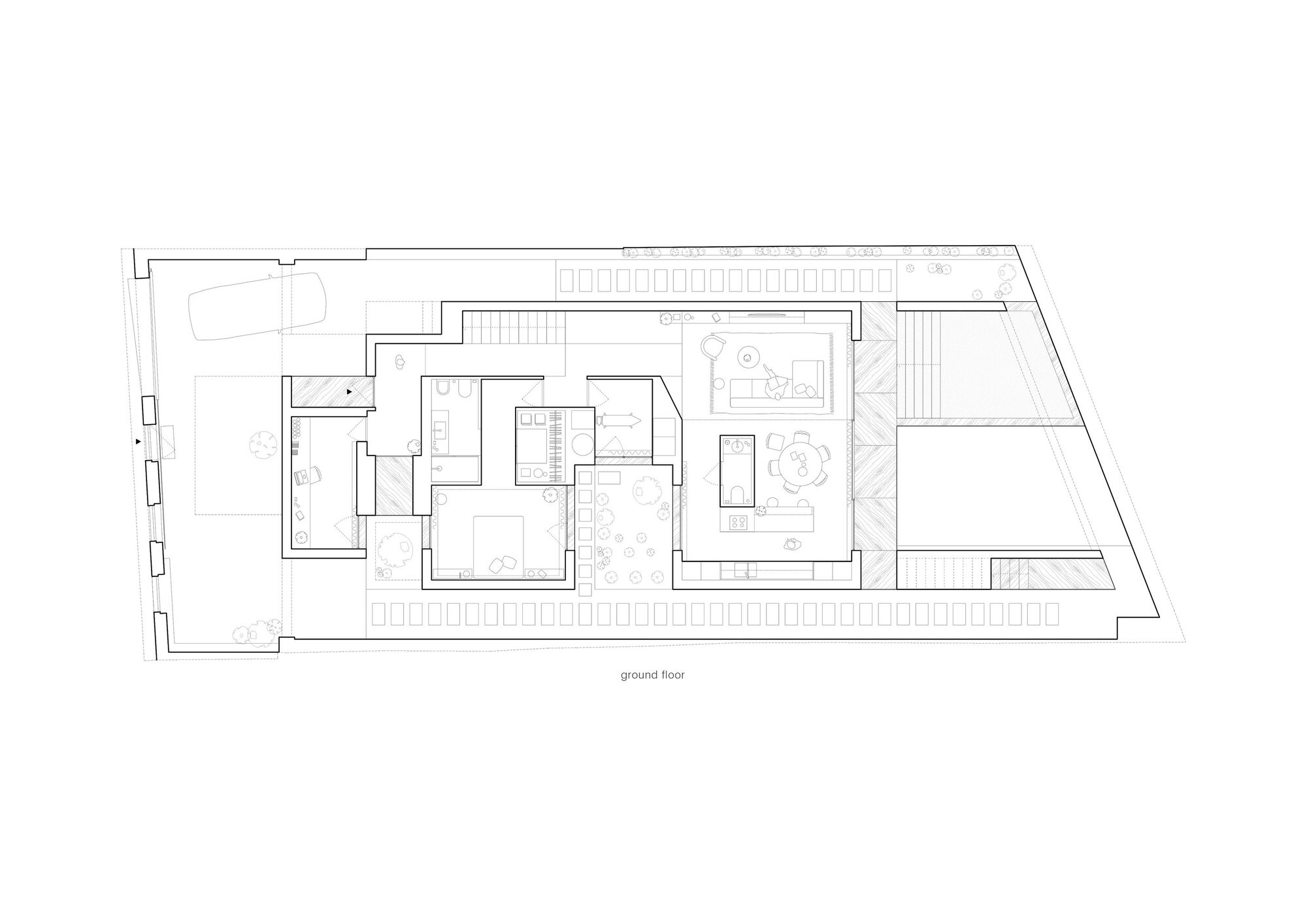 Ground floor plan drawing showing rectangular rooms arranged around courtyards with scattered tree symbols