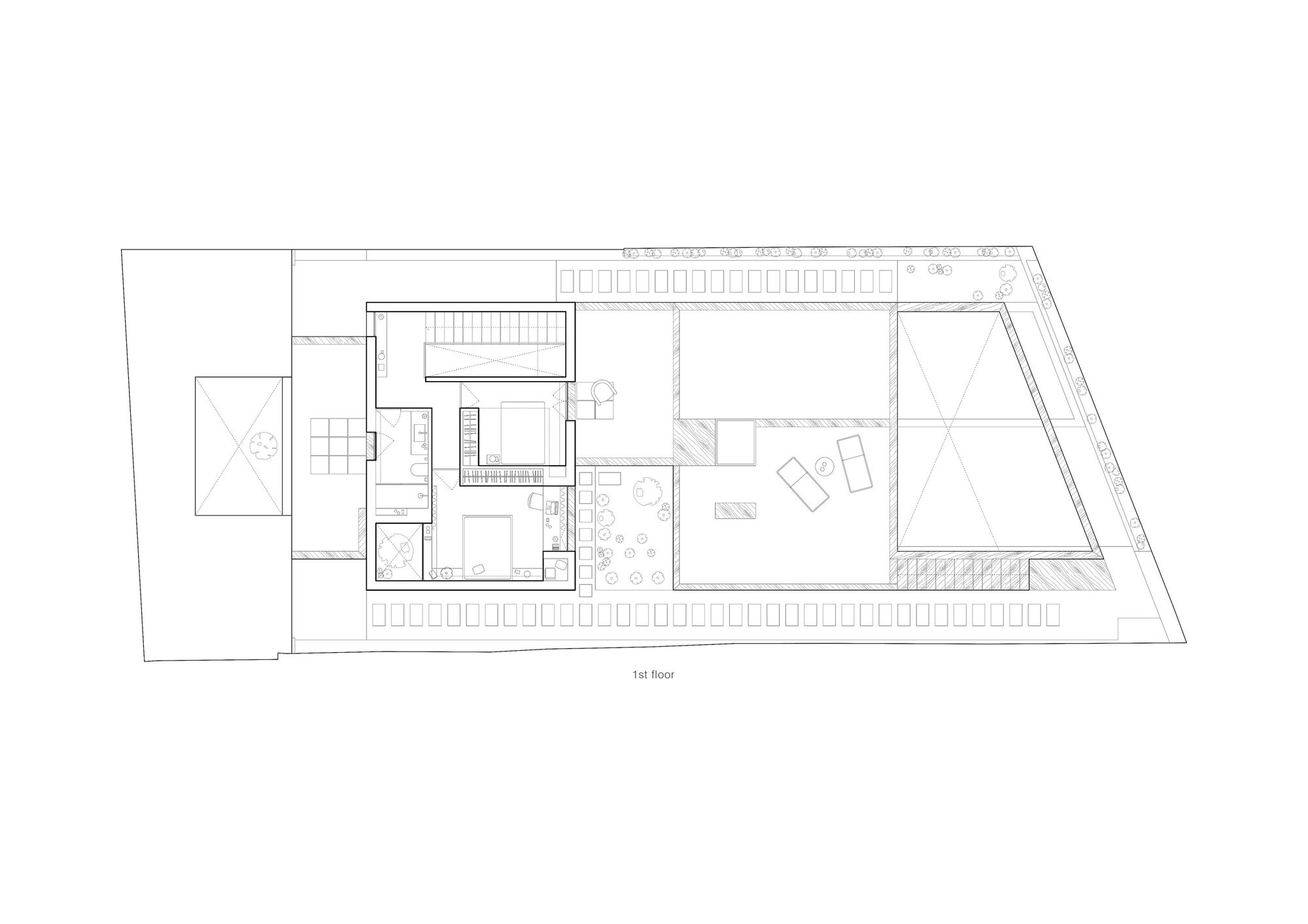 First floor plan drawing showing open living space with triangular skylights and central staircase