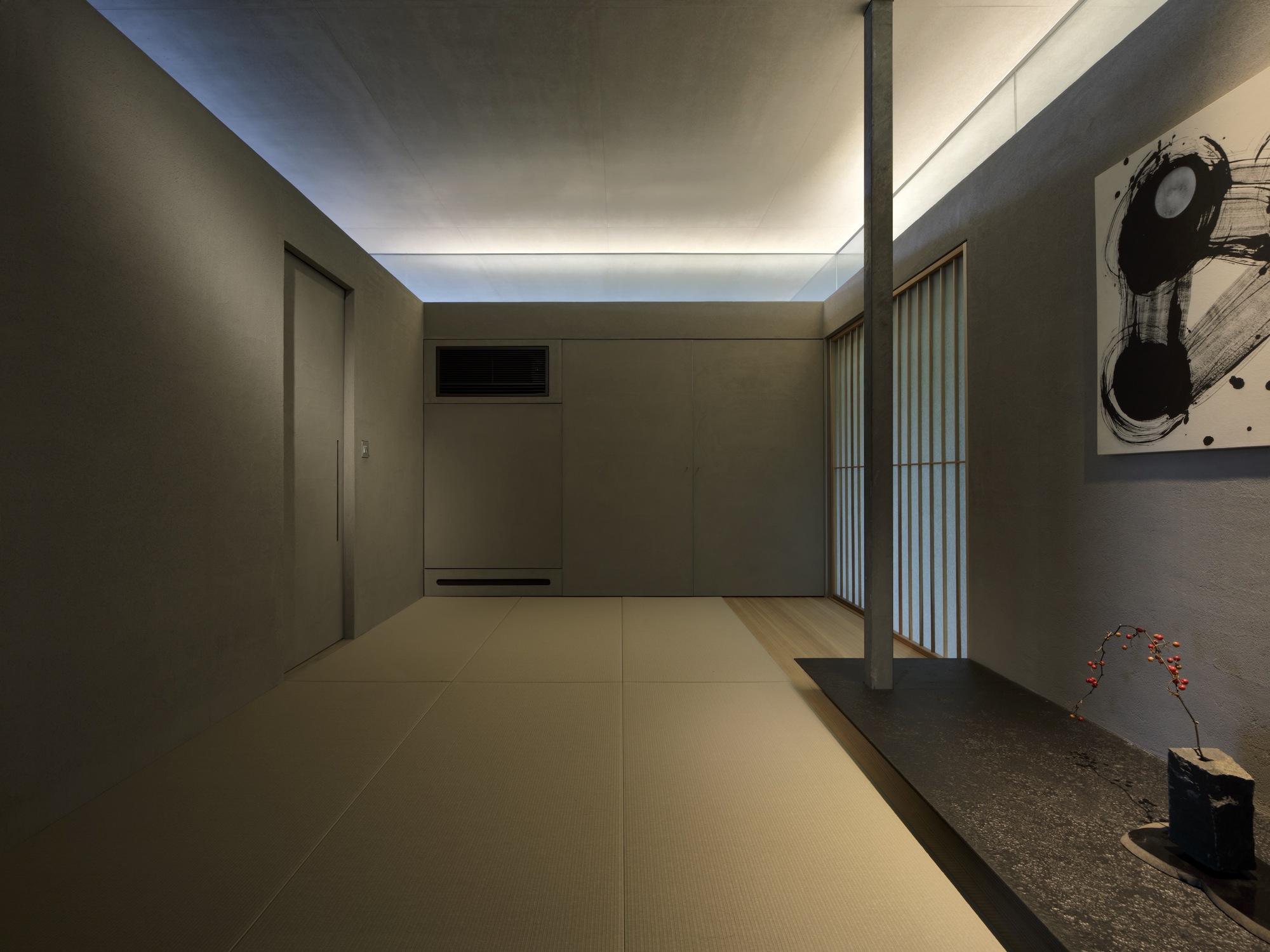 Tatami-floored room with concealed cove lighting and translucent screen illuminated at dusk