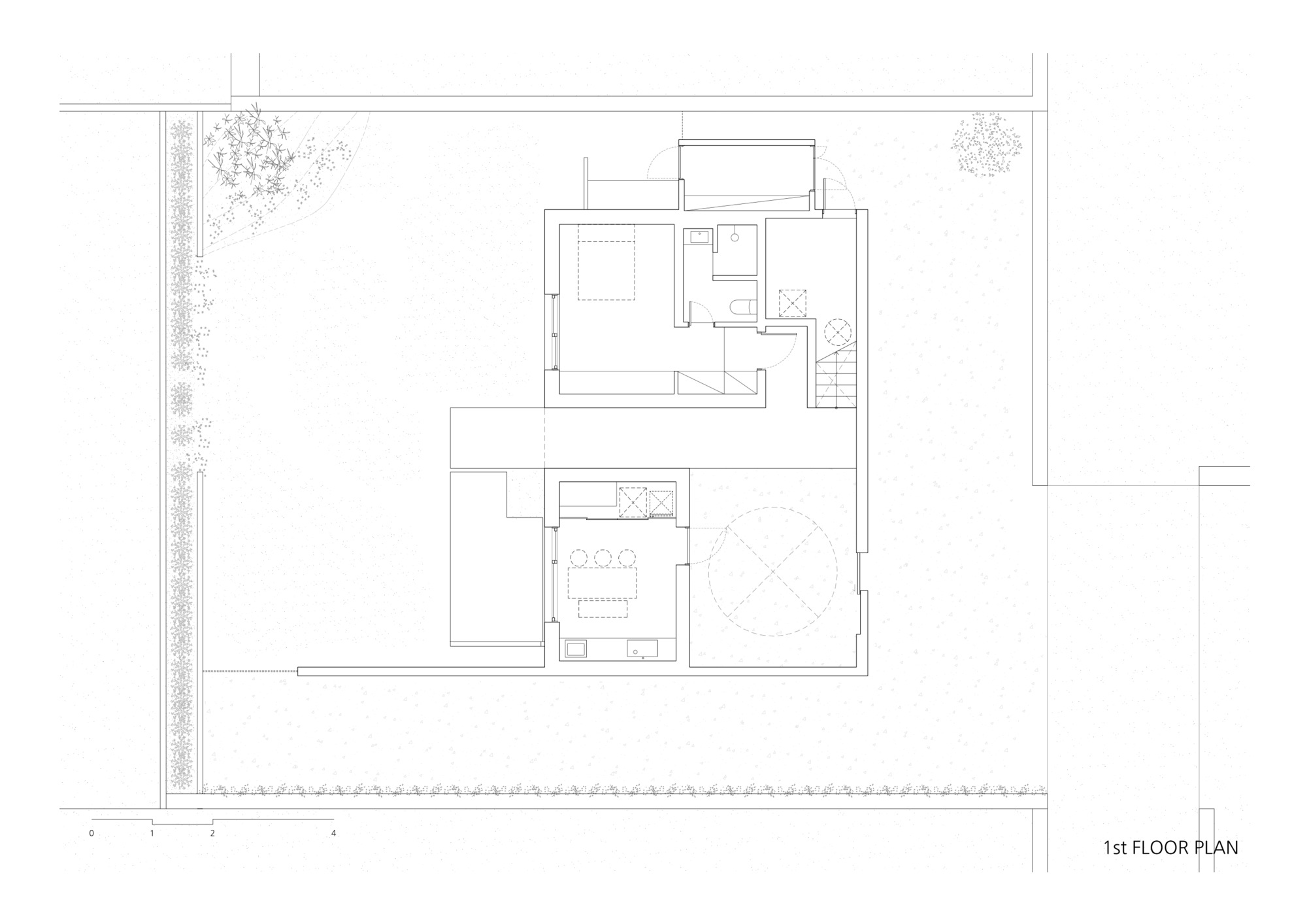 First floor plan drawing showing staircase connecting split-level spaces with circular element below