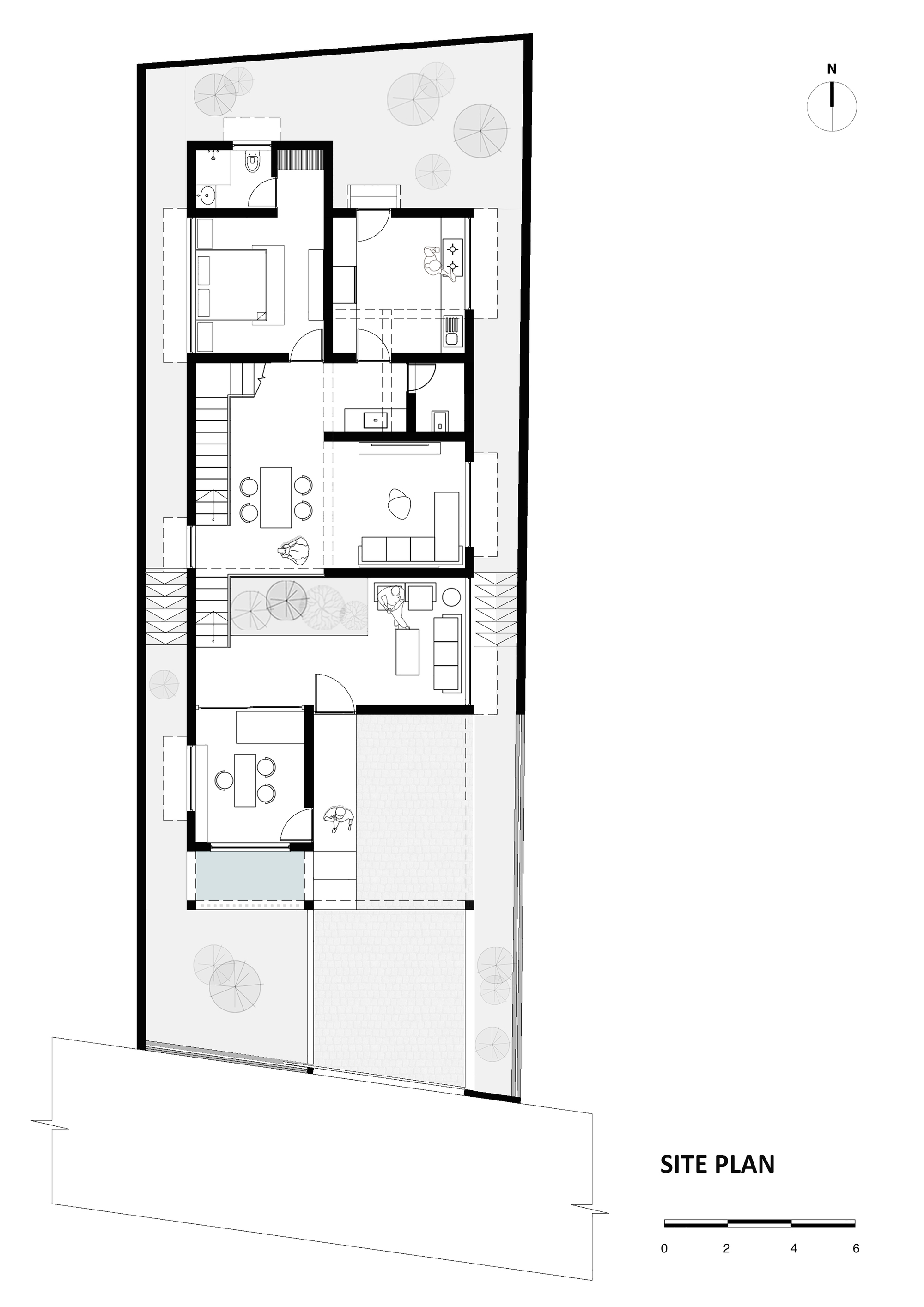 Site plan drawing showing a narrow dwelling with internal courtyard and two staircases