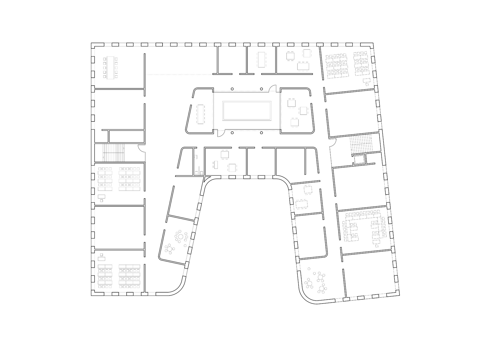 Upper floor plan drawing showing central atrium space surrounded by offices and support rooms