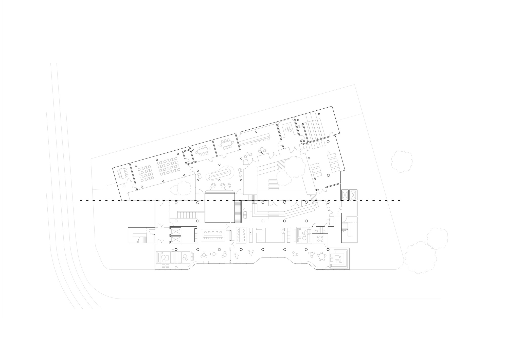 Floor plan drawing showing an angled two-wing layout with central circulation spine
