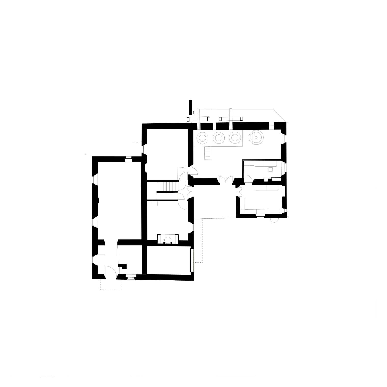 First floor plan drawing showing bedrooms and bathrooms distributed across two connected wings