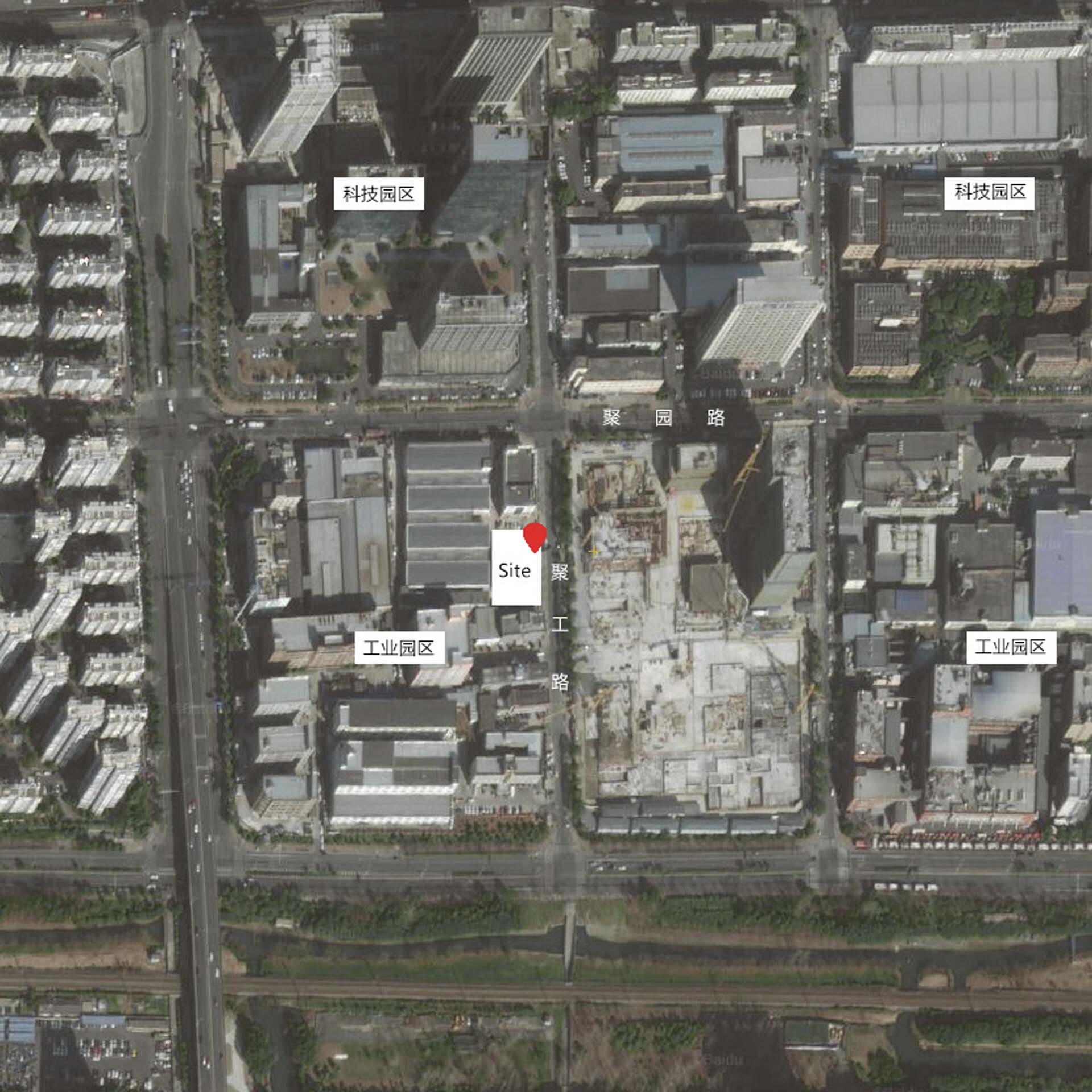 Aerial site plan showing the location marked with a red pin within a dense industrial district