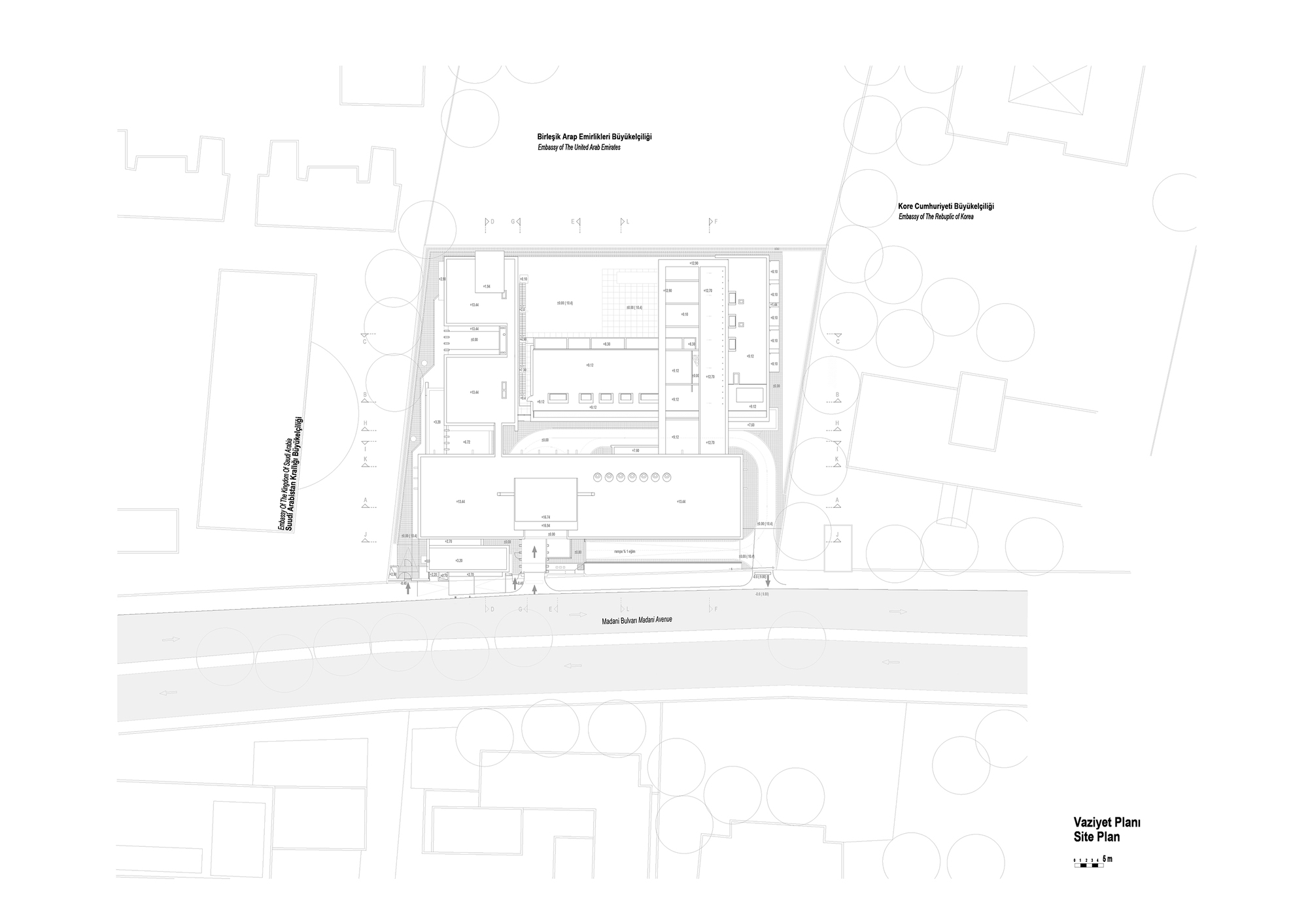 Site plan drawing showing the rectangular complex with central courtyard and surrounding street trees