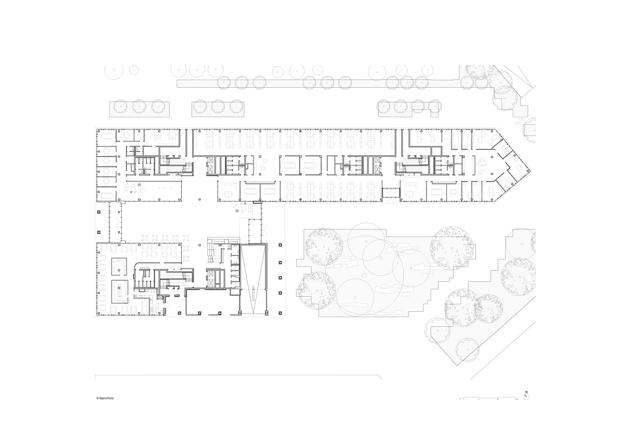 Ground floor plan drawing showing L-shaped building with interior courtyard and tree plantings