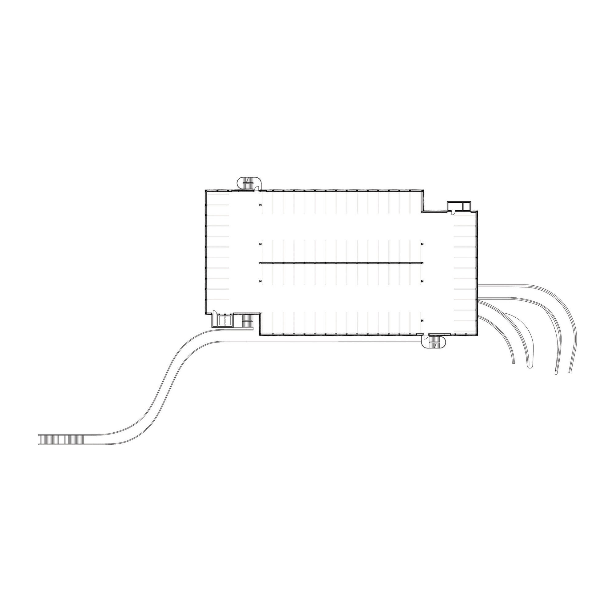 Floor plan drawing showing the rectangular volume with curving access ramps at the corner