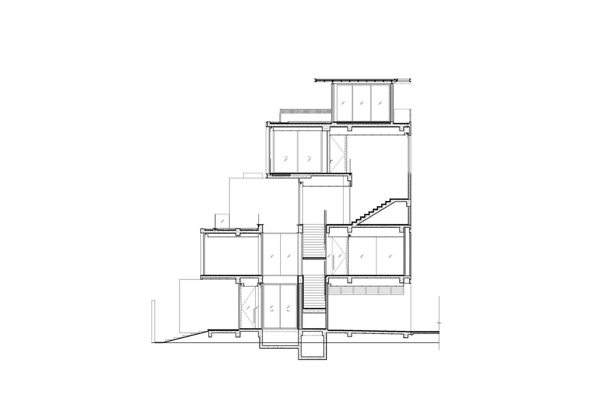 Section drawing revealing a central staircase connecting offset floor levels across the building height