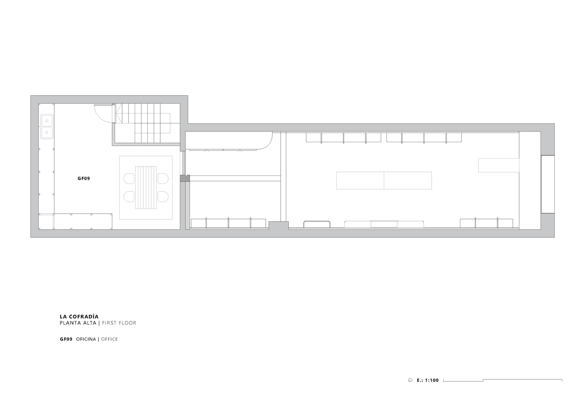 First floor plan drawing showing office space with conference table in front portion of building
