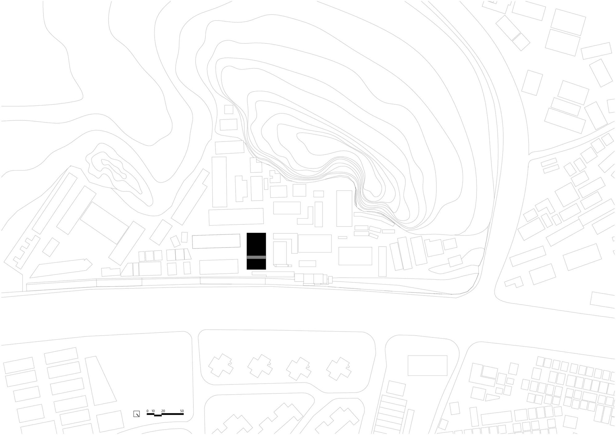 Site plan drawing showing two rectangular volumes within contoured topography and surrounding urban fabric