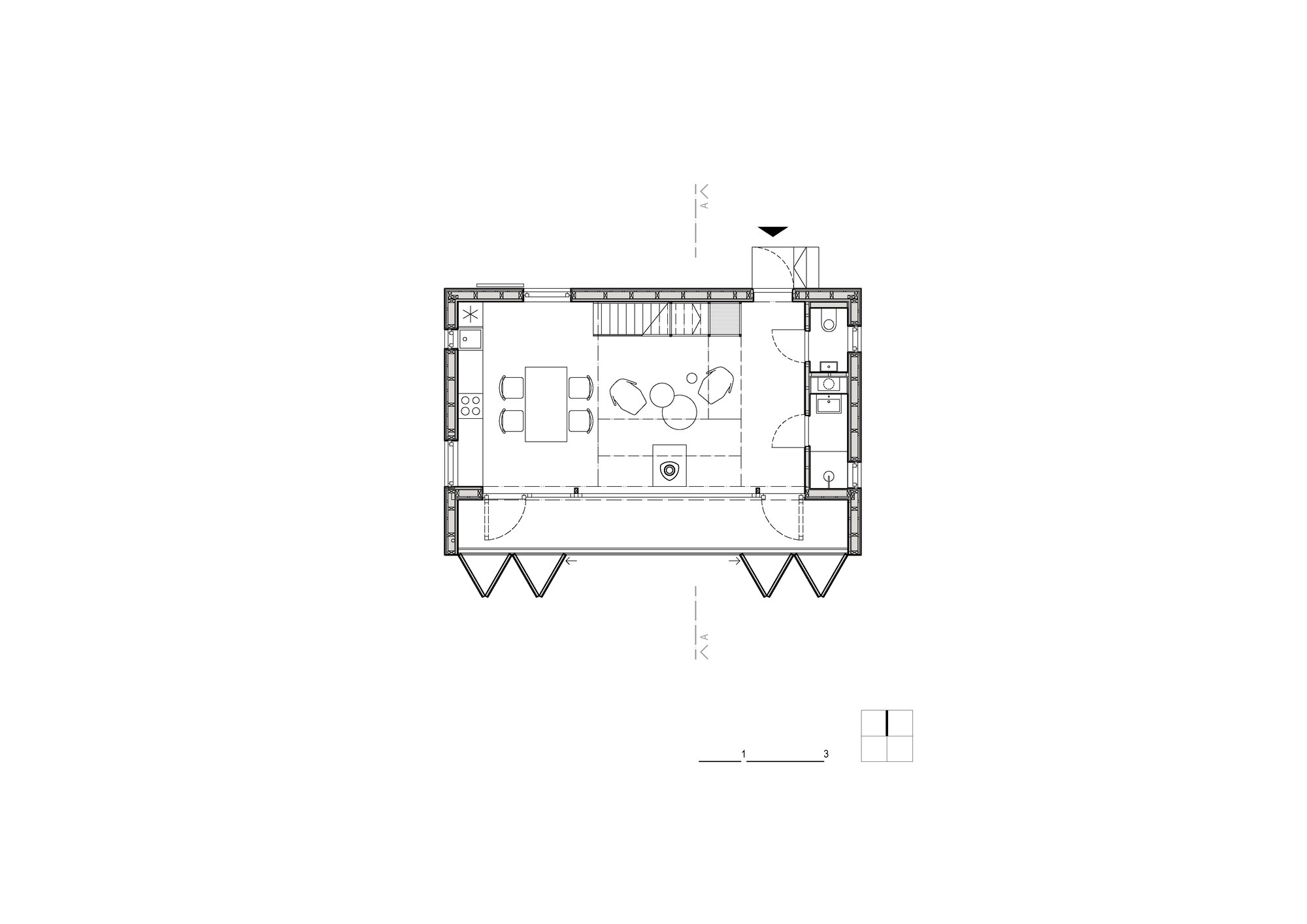 Floor plan drawing showing an open living and dining space with central fireplace