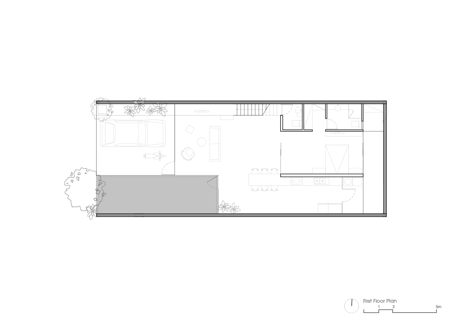 First floor plan drawing showing a linear layout with courtyard, stair, and service rooms