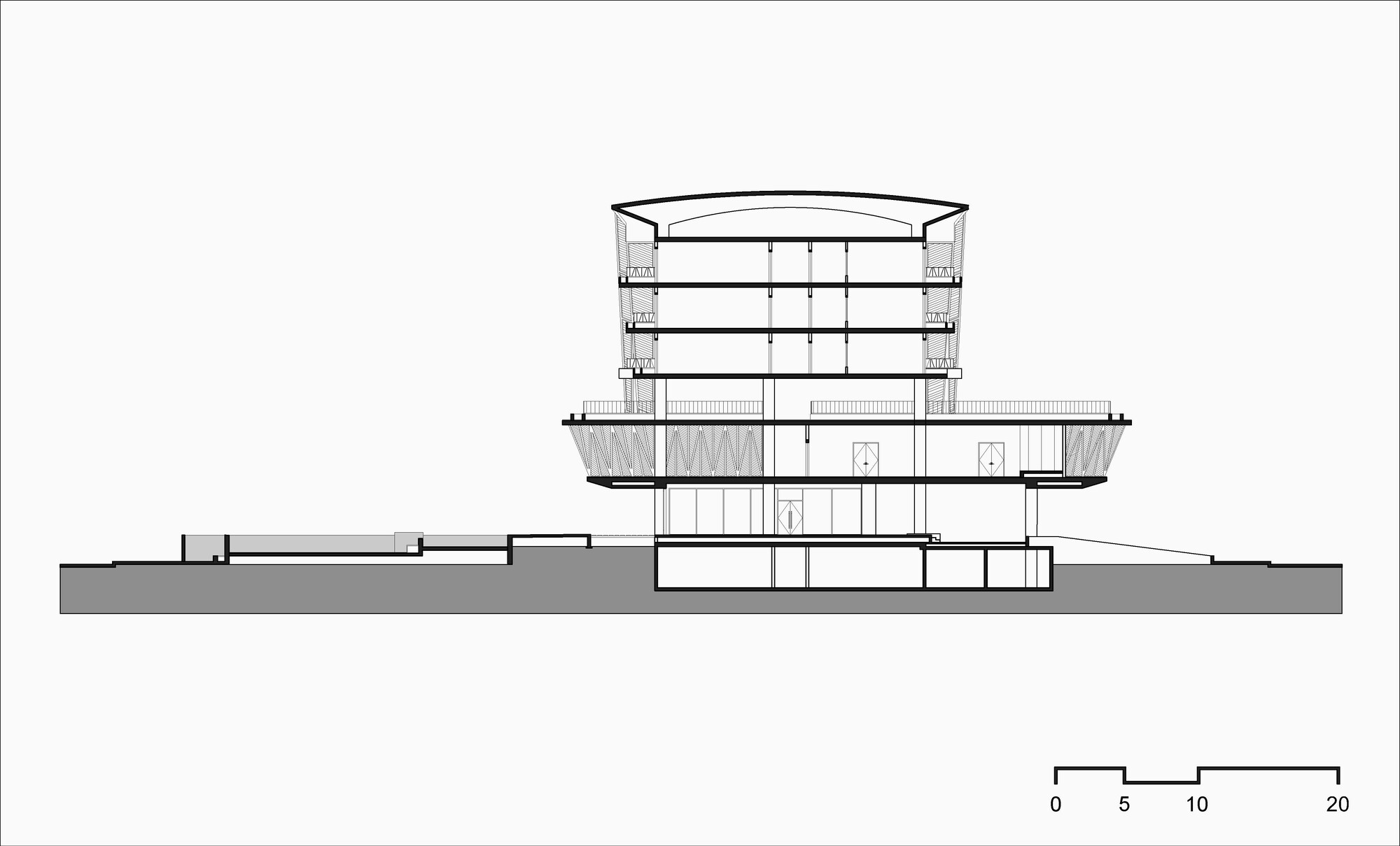 Section drawing through the curved-roof tower showing multiple floors and underground parking levels