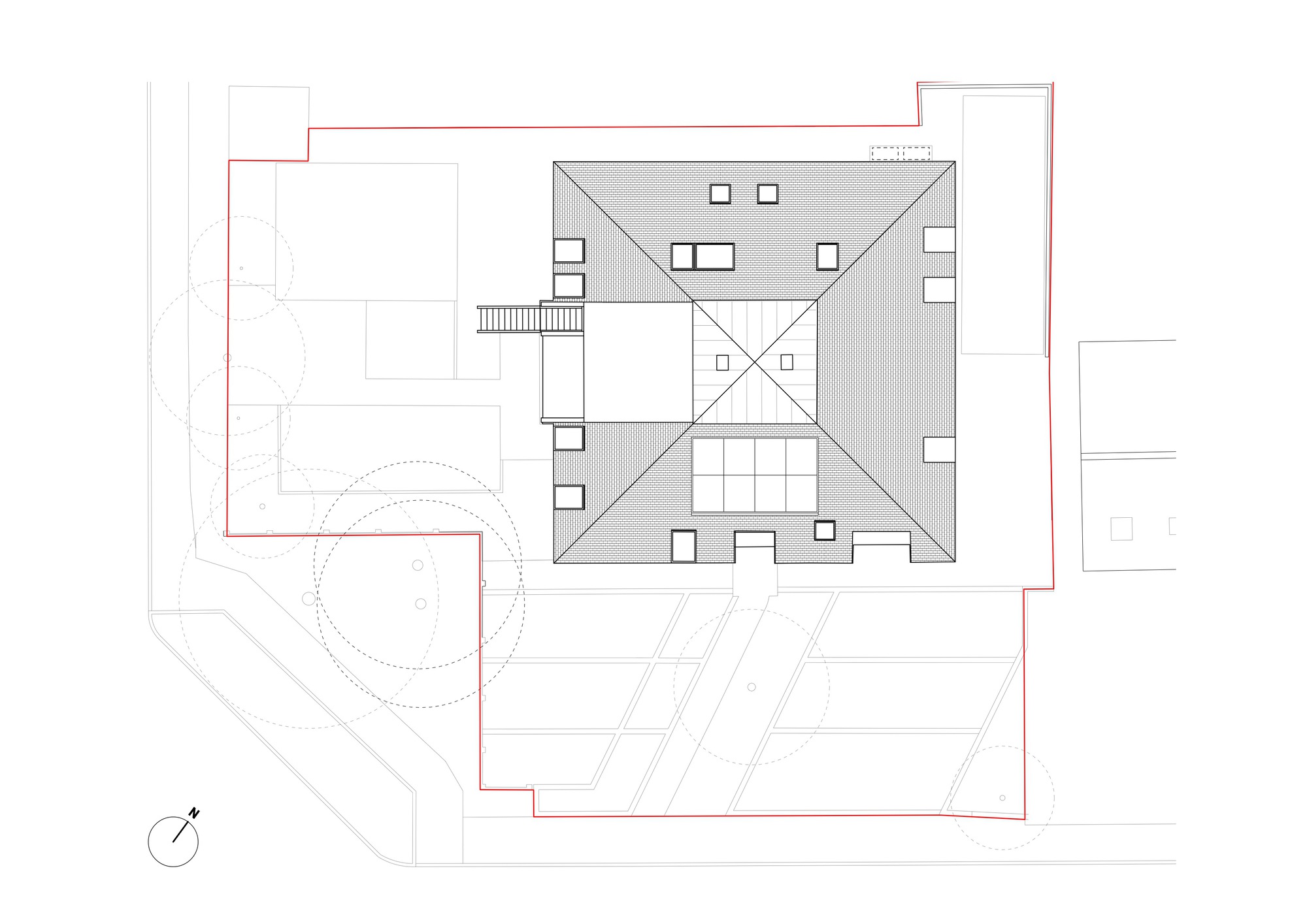 Roof plan drawing showing a square structure with central skylight and courtyard surrounded by adjoining volumes