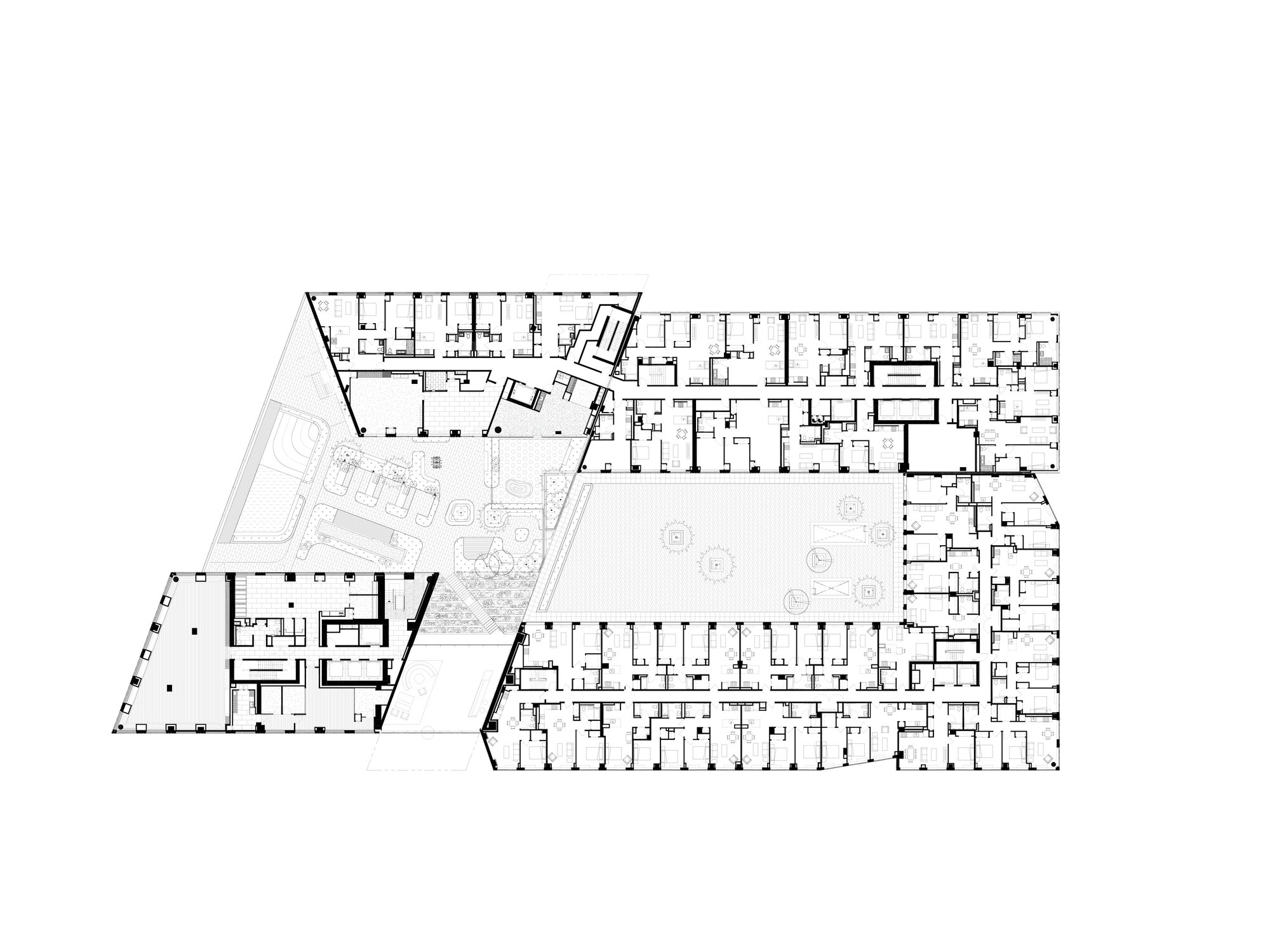Floor plan showing residential units arranged around a central courtyard with landscaping