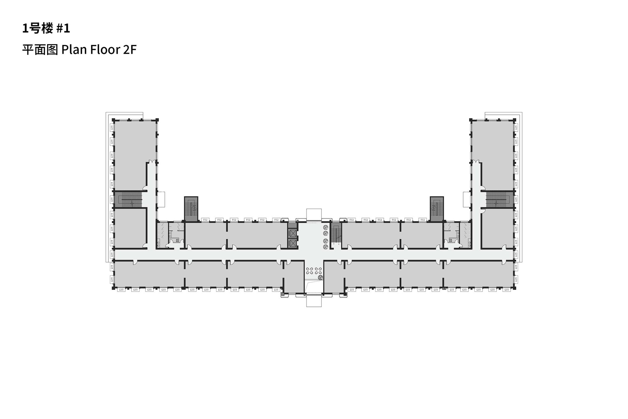 Second floor plan depicting mirrored wings flanking a central circulation core and stair volumes