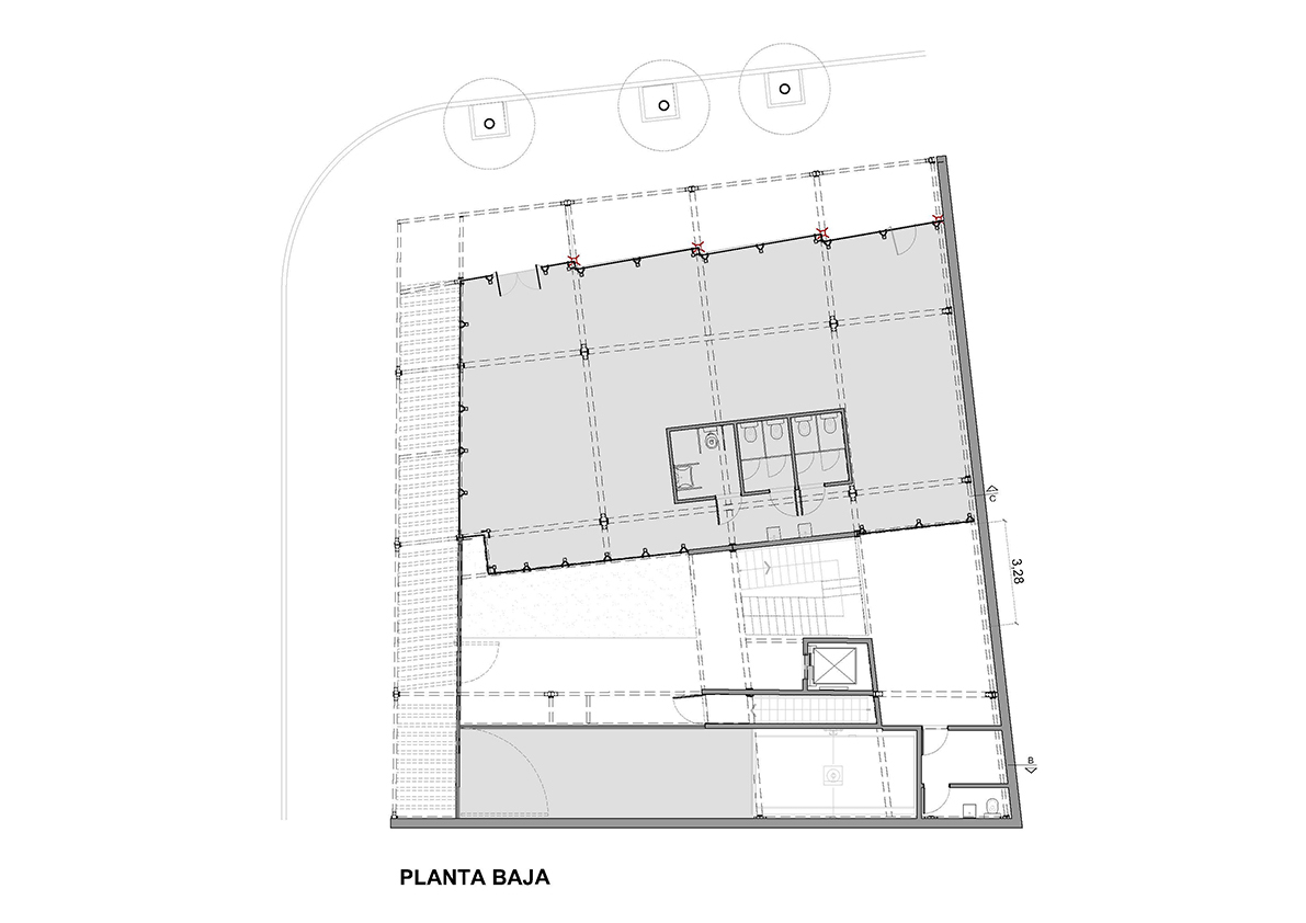 Ground floor plan drawing showing circulation areas and central service core with restrooms
