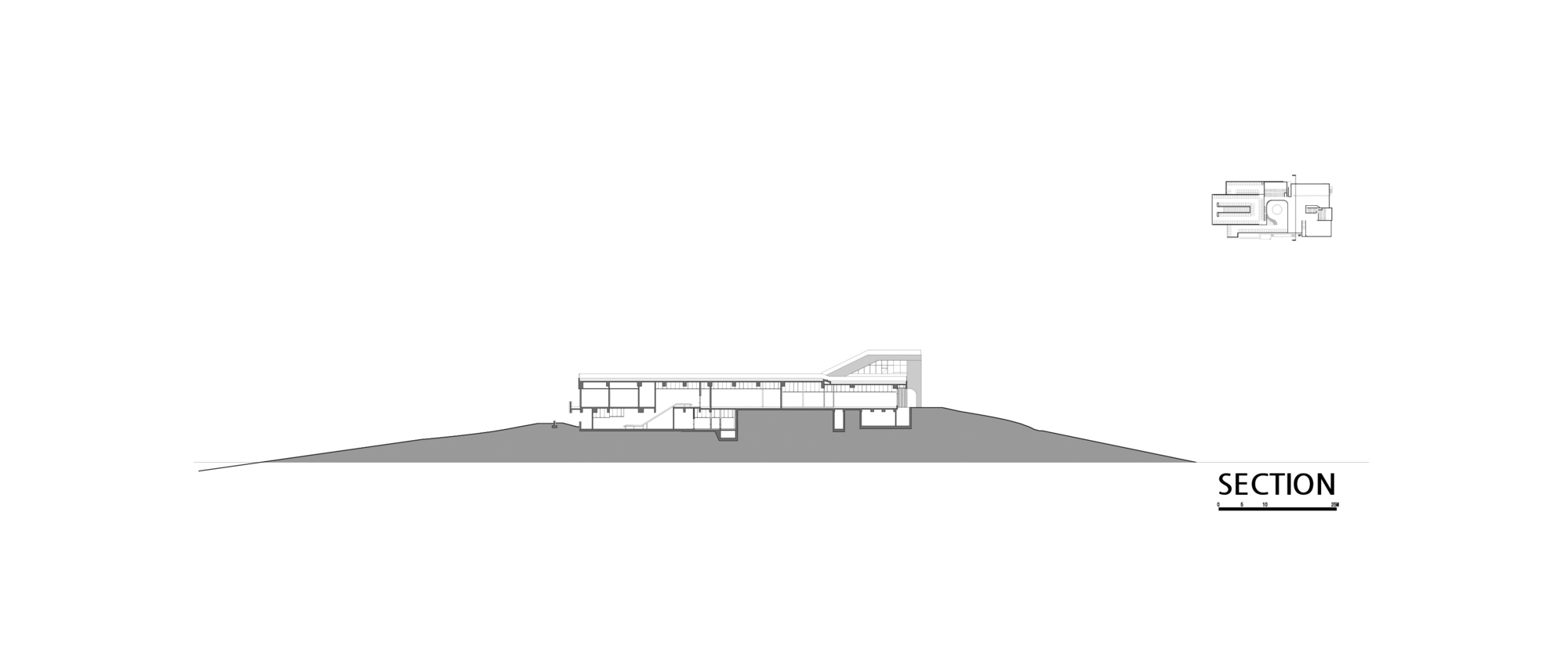Section drawing showing the building's linear layout following the hillside gradient