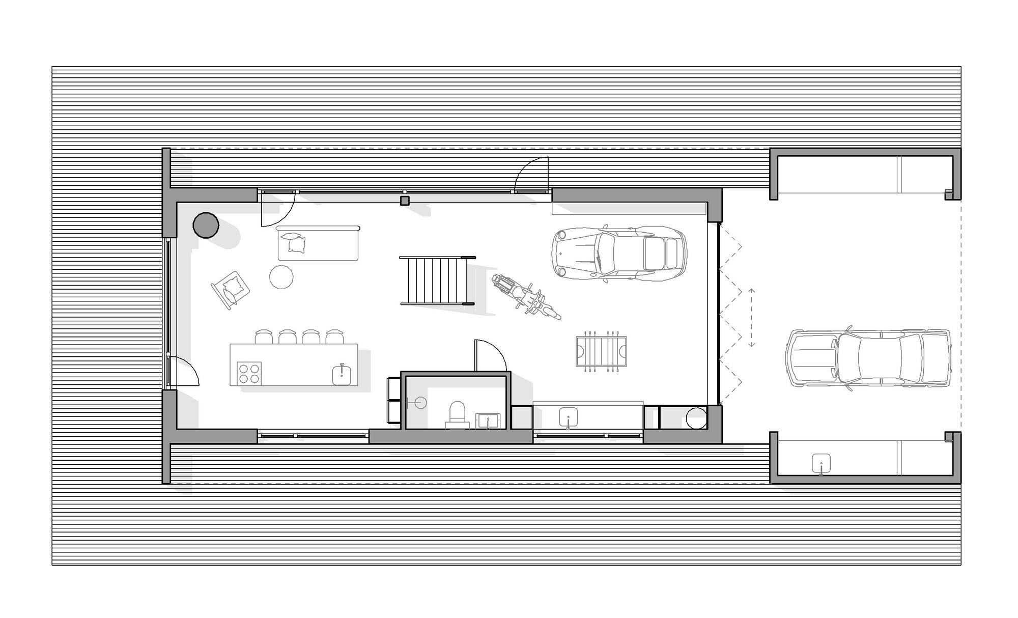 Floor plan drawing showing open living area, motorcycle, vehicle parking, and stair to upper level