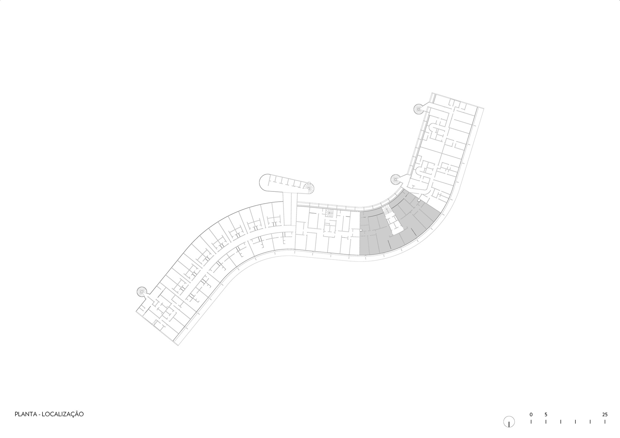 Site plan drawing showing a curved bar building with repeated cellular units along its length