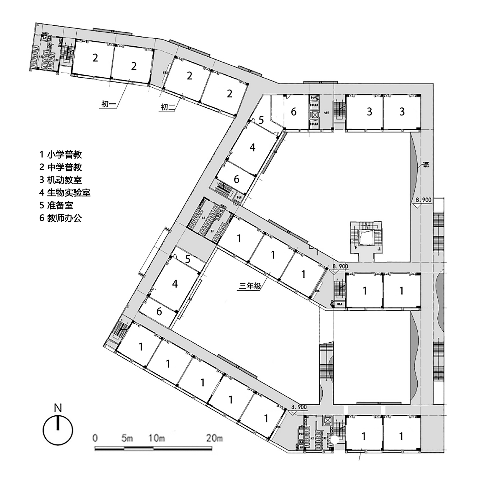 Floor plan of an angled classroom wing wrapping around a central courtyard with scale bar