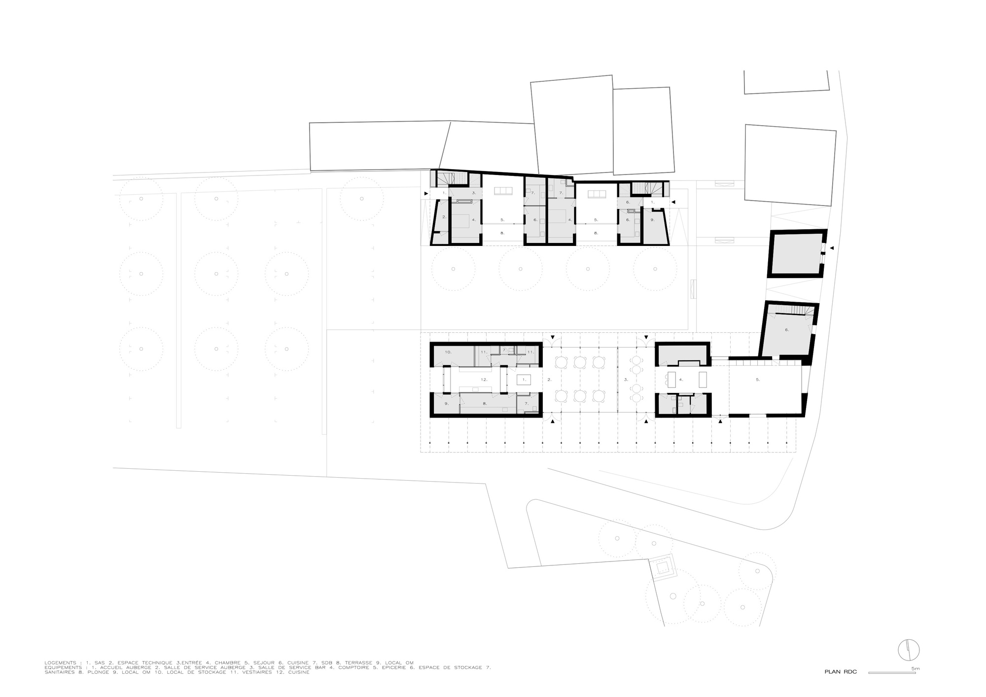Floor plan drawing showing multiple building volumes arranged around a central outdoor space