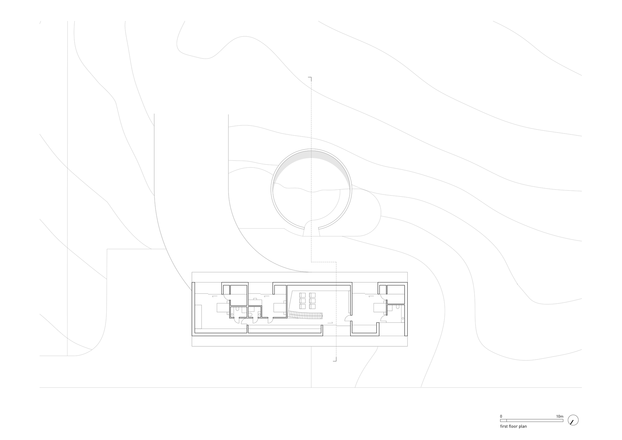 First floor plan drawing revealing a circular upper level connected to a linear wing